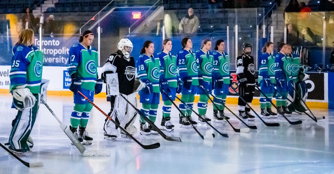 The Connecticut Whale stand at the blueline at Mattamy Athletic Centre for the anthem.