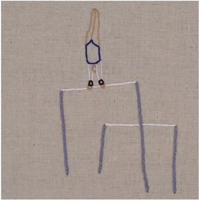 A still of an embroidered gymnast doing a handstand on the high bar.