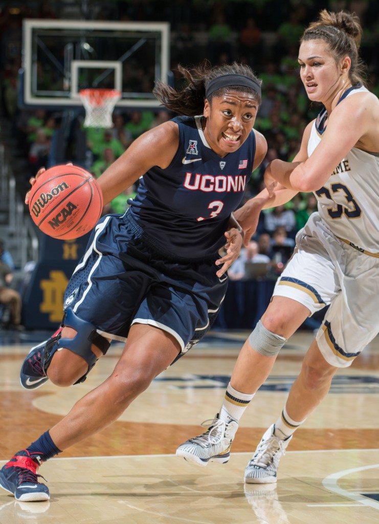 UConn forward Morgan Tuck drives to the basket against Notre Dame defender Kathryn Westbeld