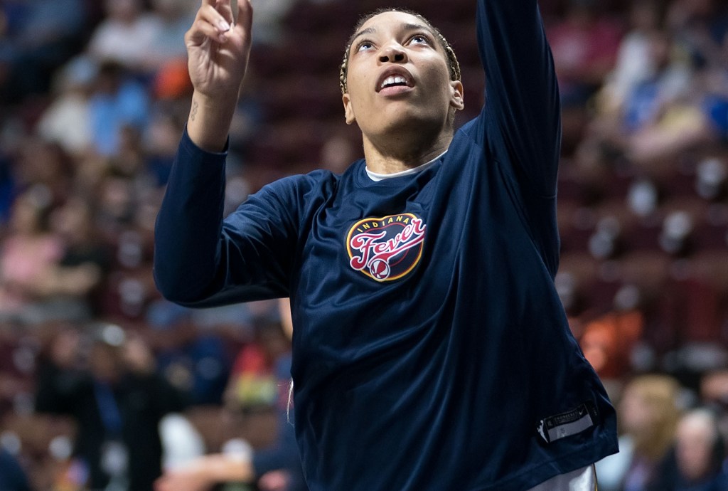 Indiana Fever forward Victaria Saxton takes a layup during warmups.