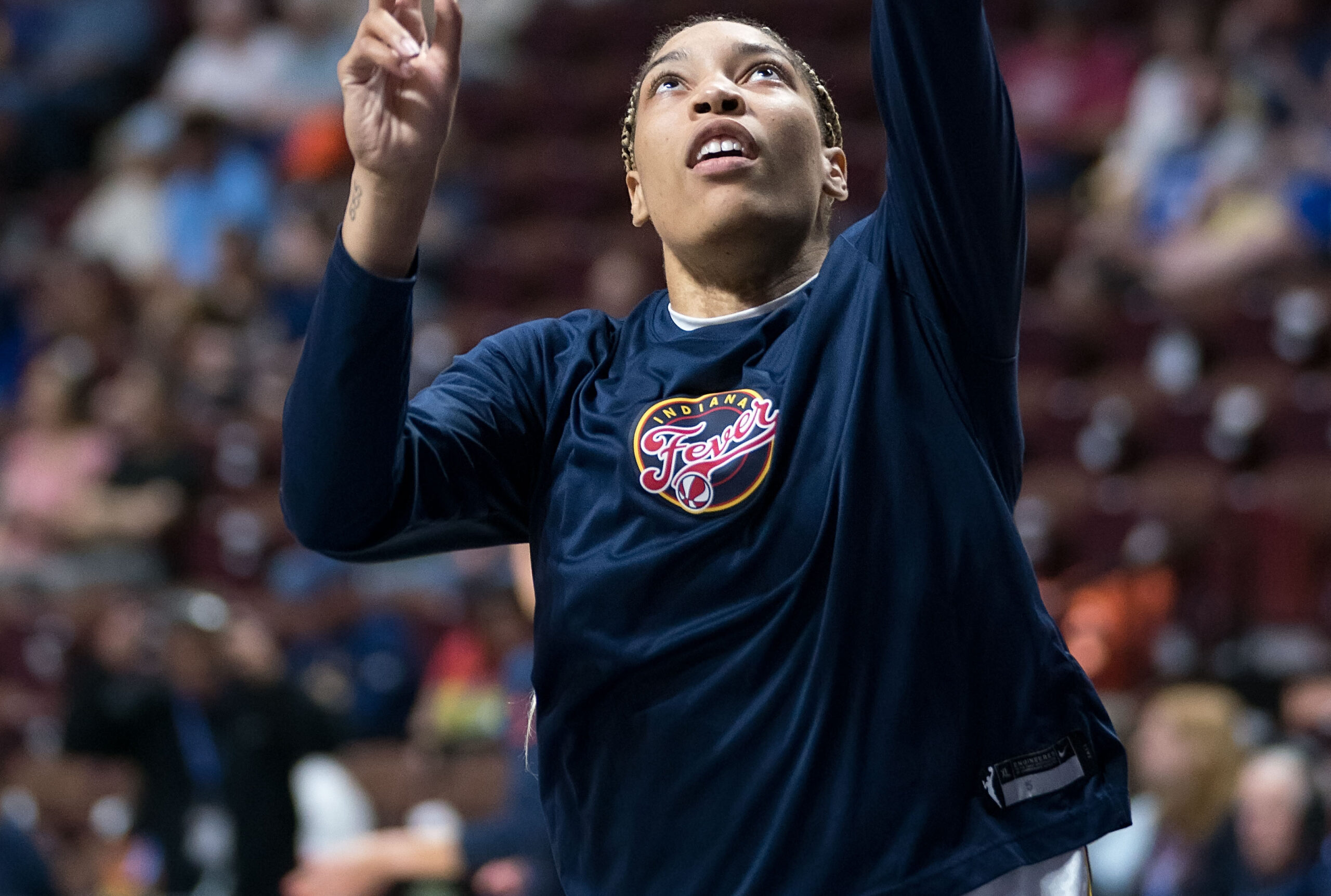 Indiana Fever forward Victaria Saxton takes a layup during warmups.