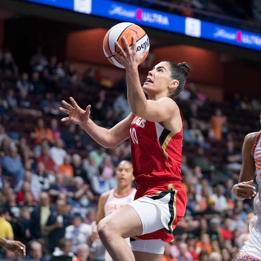 Las Vegas Aces guard Kelsey Plum shoots an open left-handed layup.