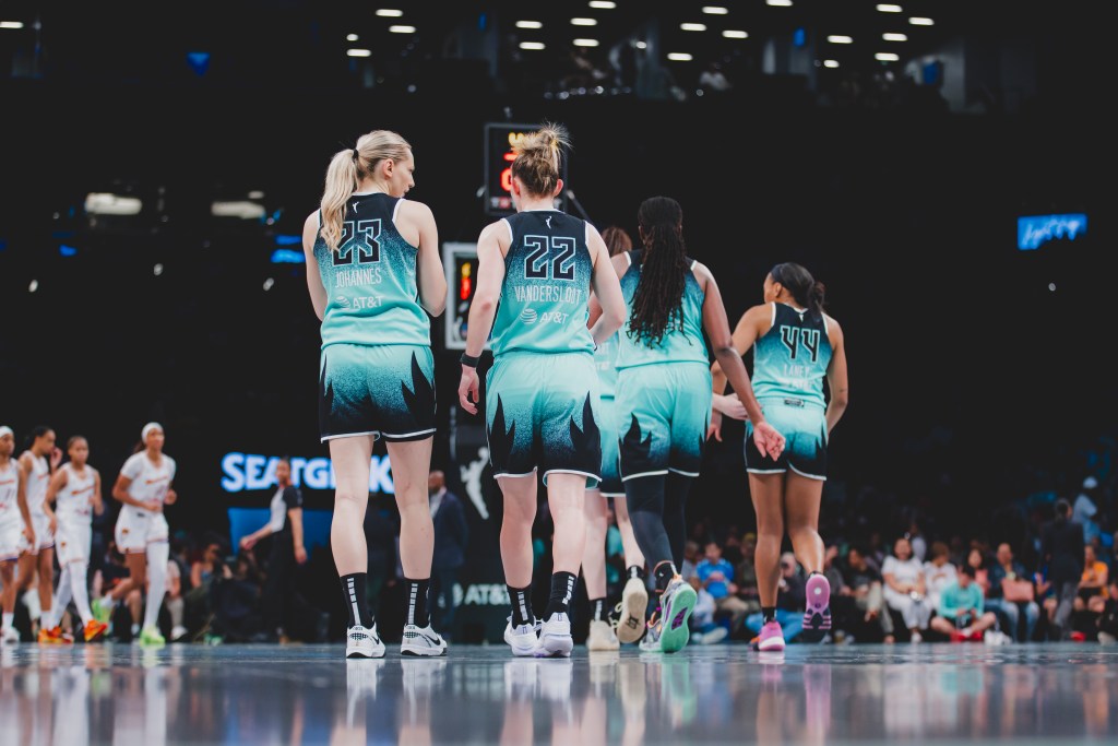 The New York Liberty including Marine Johannès (23), Courtney Vandersloot (22), Jonquel Jones (35) and Betnijah Laney get ready to take the court at Barclays Center in Brooklyn, NY against the Phoenix Mercury.
