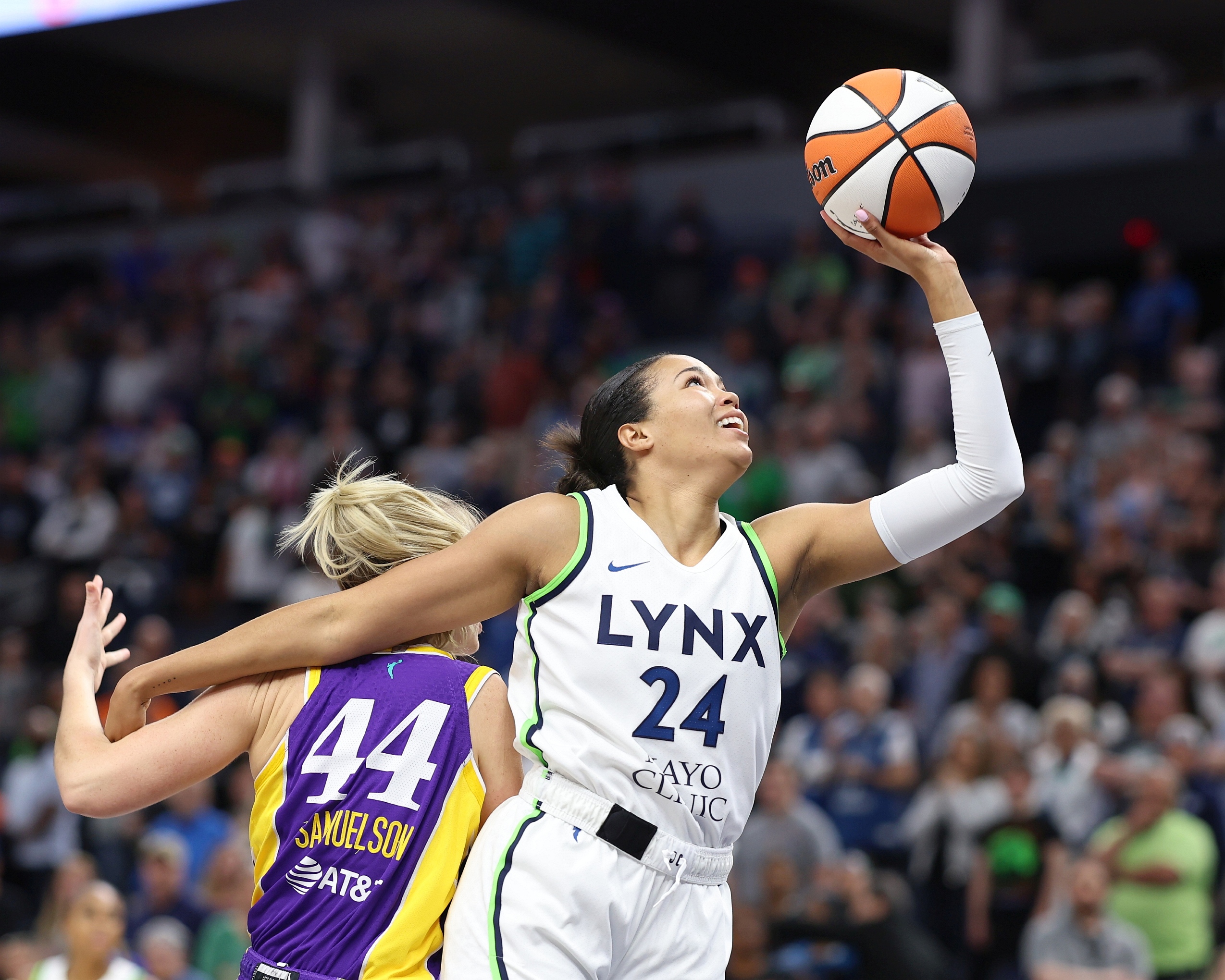Minnesota's Napheesa Collier drives to the basket against the Los Angeles Sparks in a 91-86 win on June 11 at Target Center in Minneapolis (Photo Credit: John McClellan)