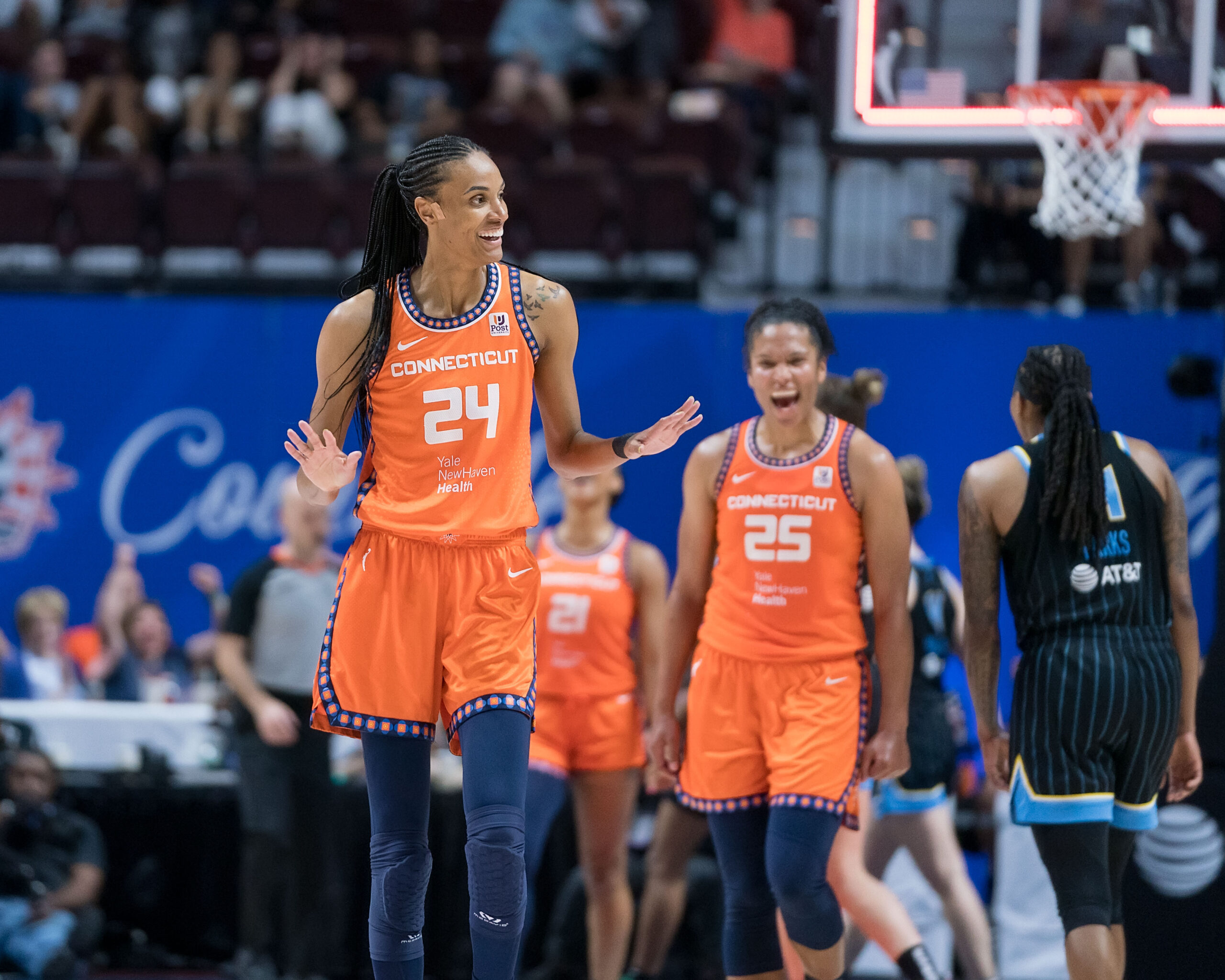 The Connecticut Sun’s DeWanna Bonner and Alyssa Thomas smile on the court.