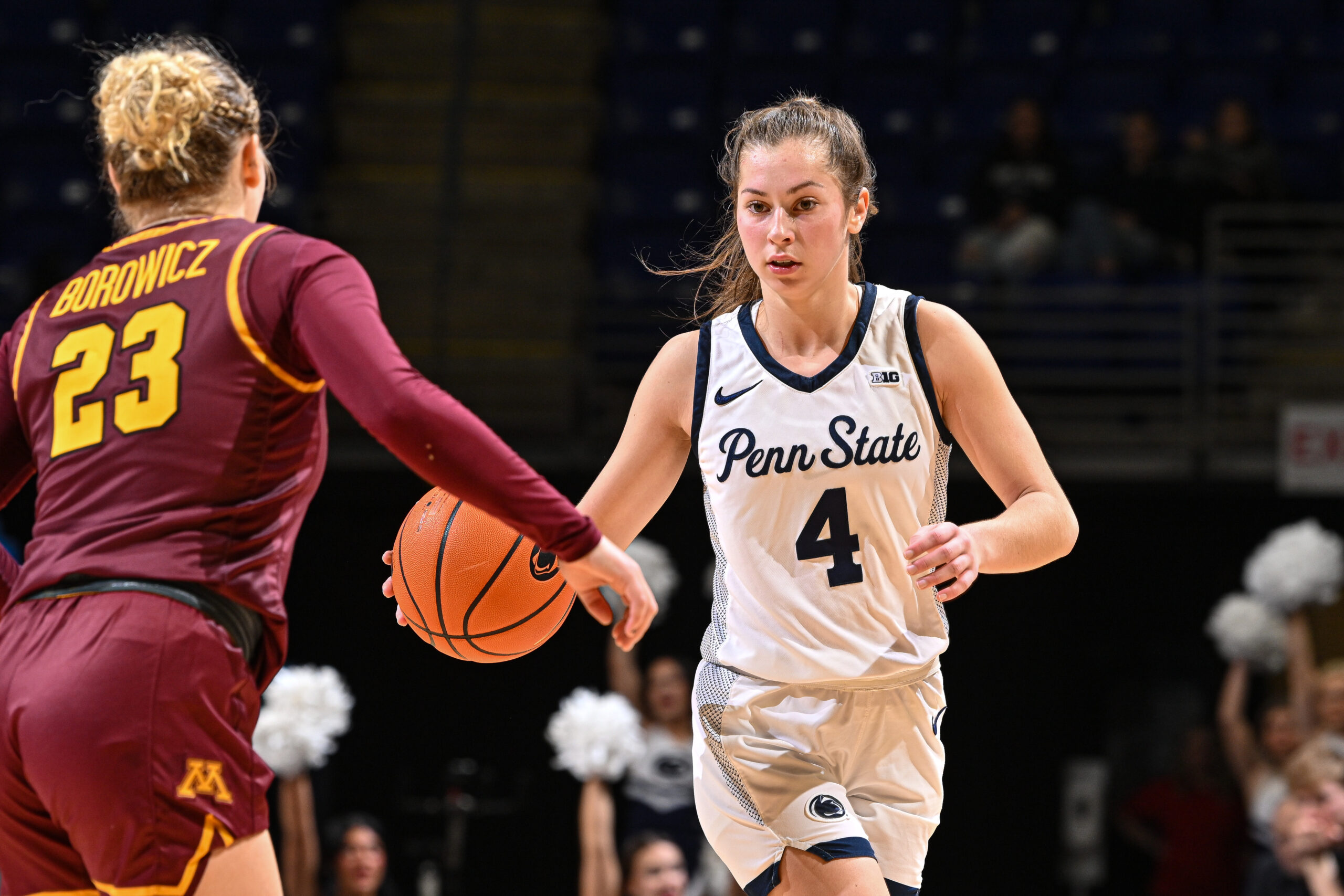 Penn State Shay Ciezki dribbles the ball with her right hand in Big Ten play. She has her eyes up as a Minnesota defender approaches.