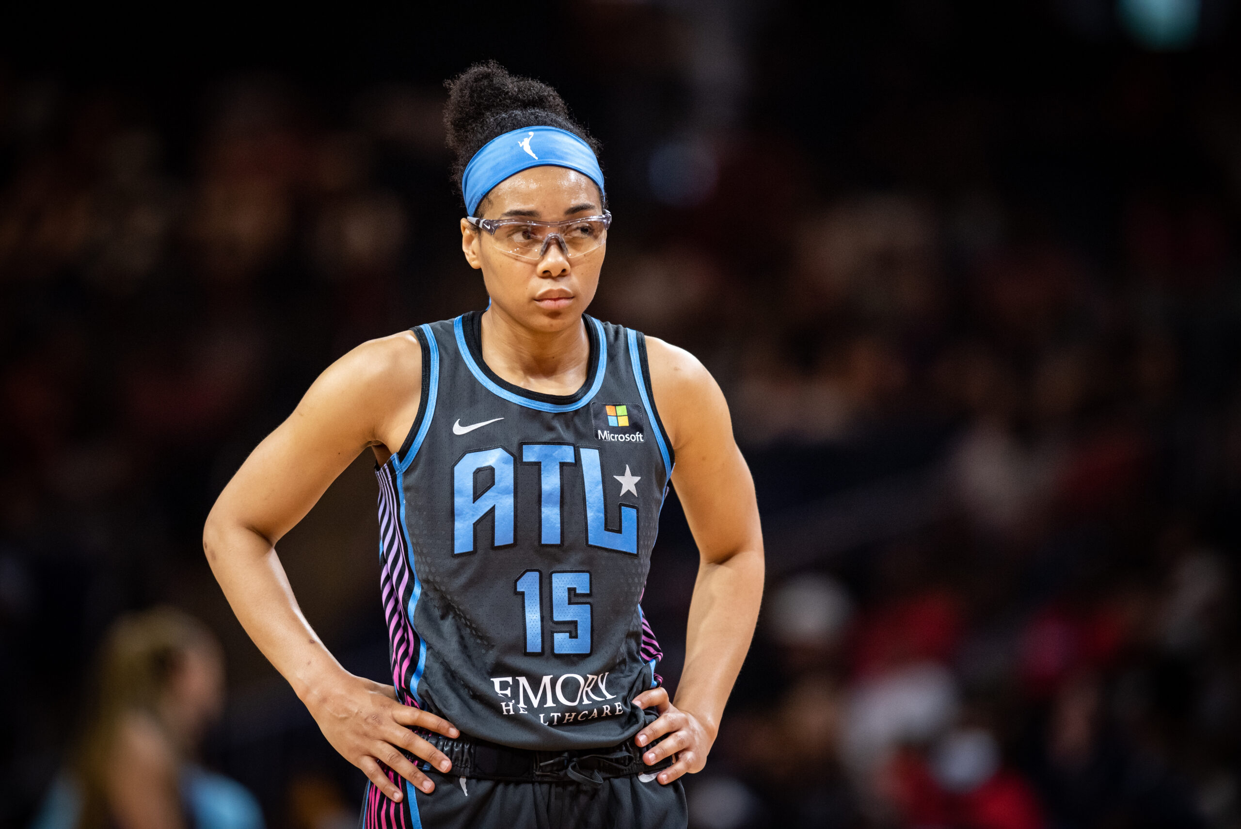 Atlanta Dream guard Allisha Gray stands on the court with her hands on her hips.
