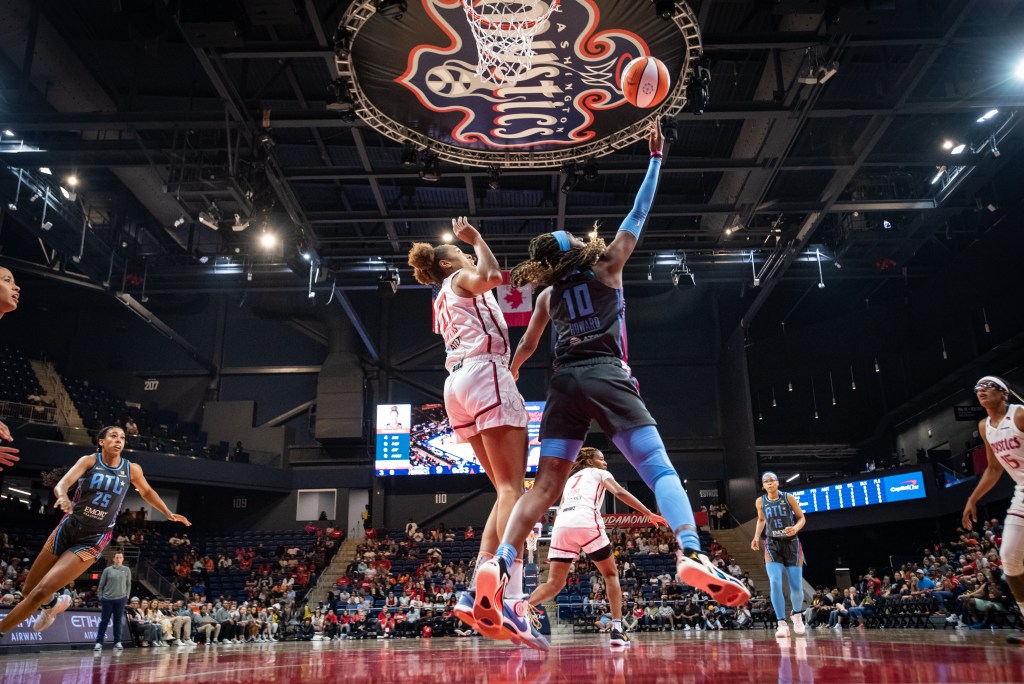 Atlanta Dream's Rhyne Howard (10, gray) drives to the basket in Washington, D.C. on Wednesday, June 28, 2023.