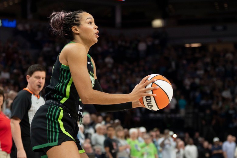 Minnesota forward Napheesa Collier prepares to take a shot near the sideline.