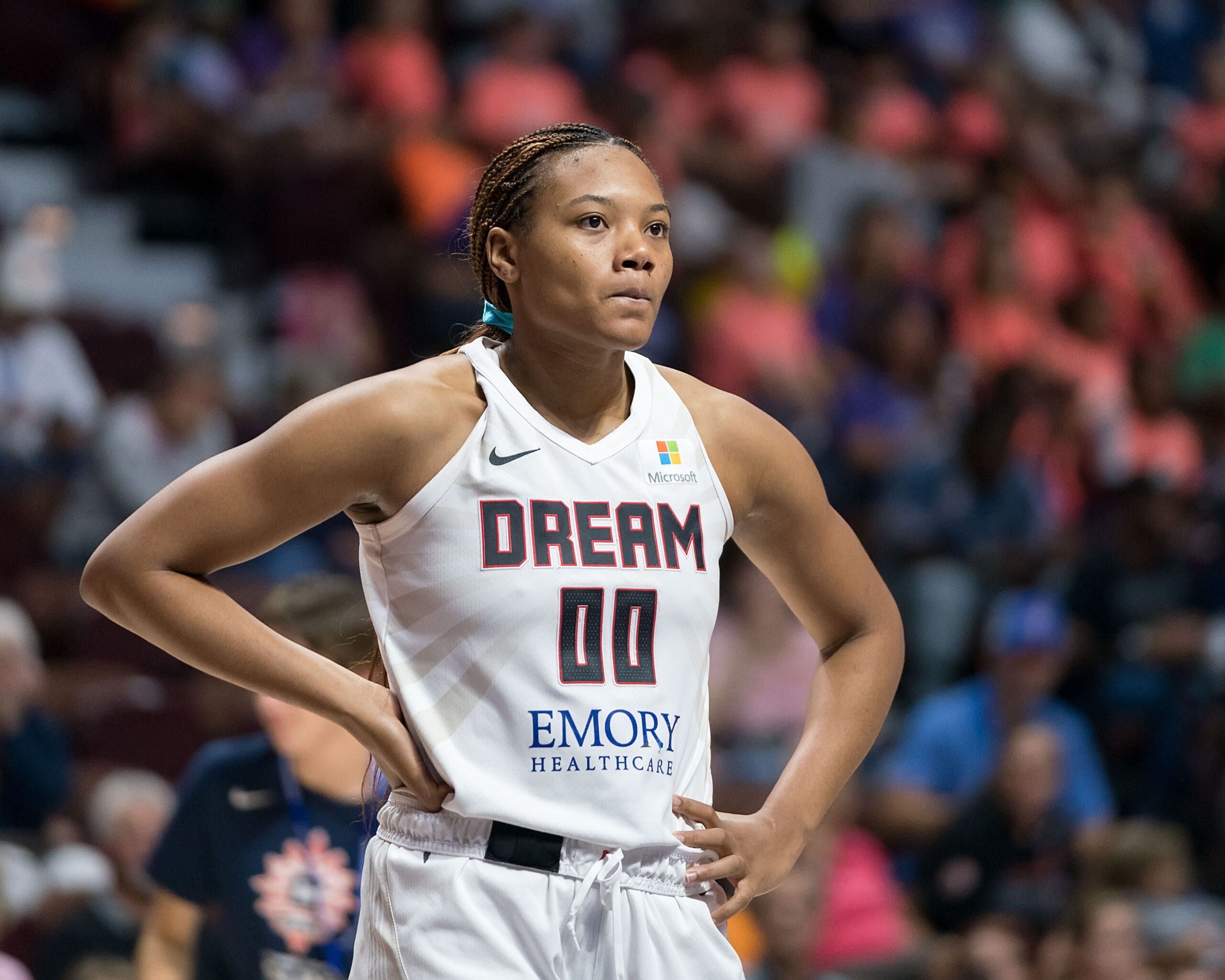 Atlanta Dream forward Naz Hillmon stands with hands on her waist during a game