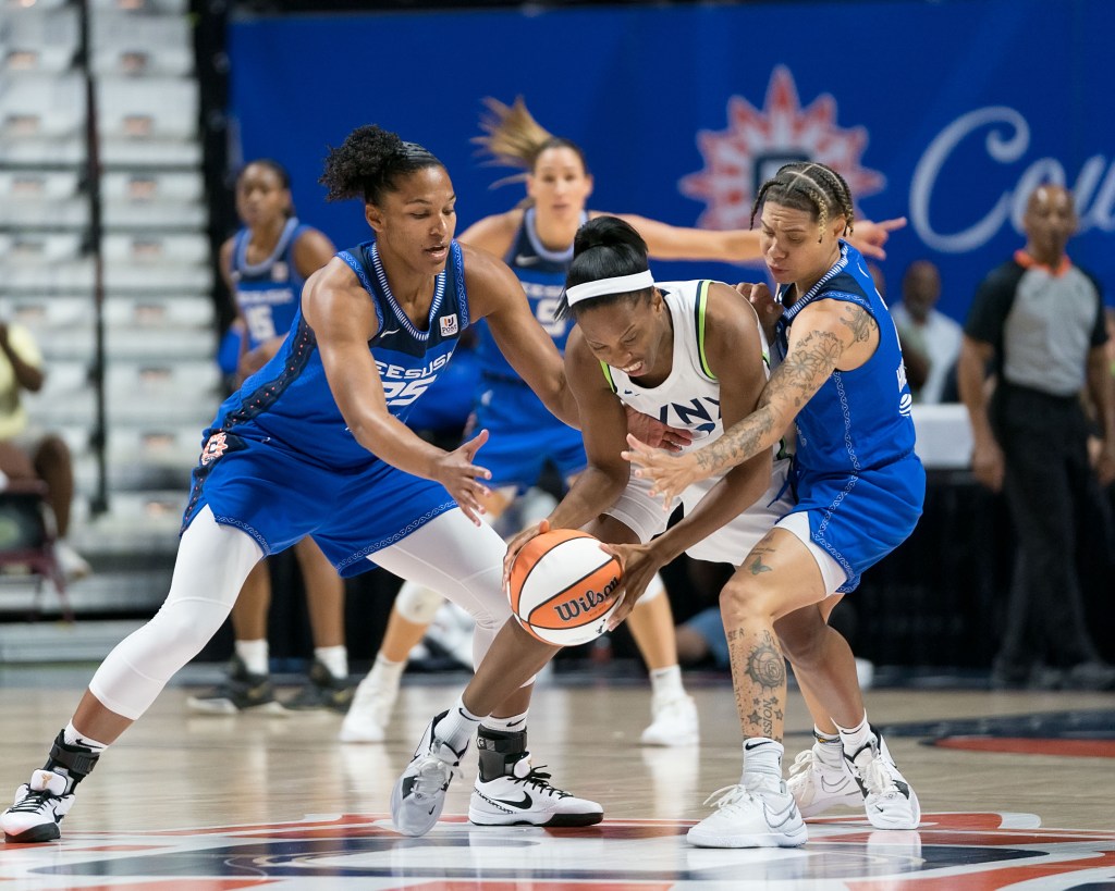 Connecticut Sun forward Alyssa Thomas (25) and Connecticut Sun guard Natisha Hiedeman (2) defend Minnesota Lynx guard Lindsay Allen (2) during the WNBA game between the Minnesota Lynx and the Connecticut Sun at Mohegan Sun Arena, Uncasville, Connecticut.