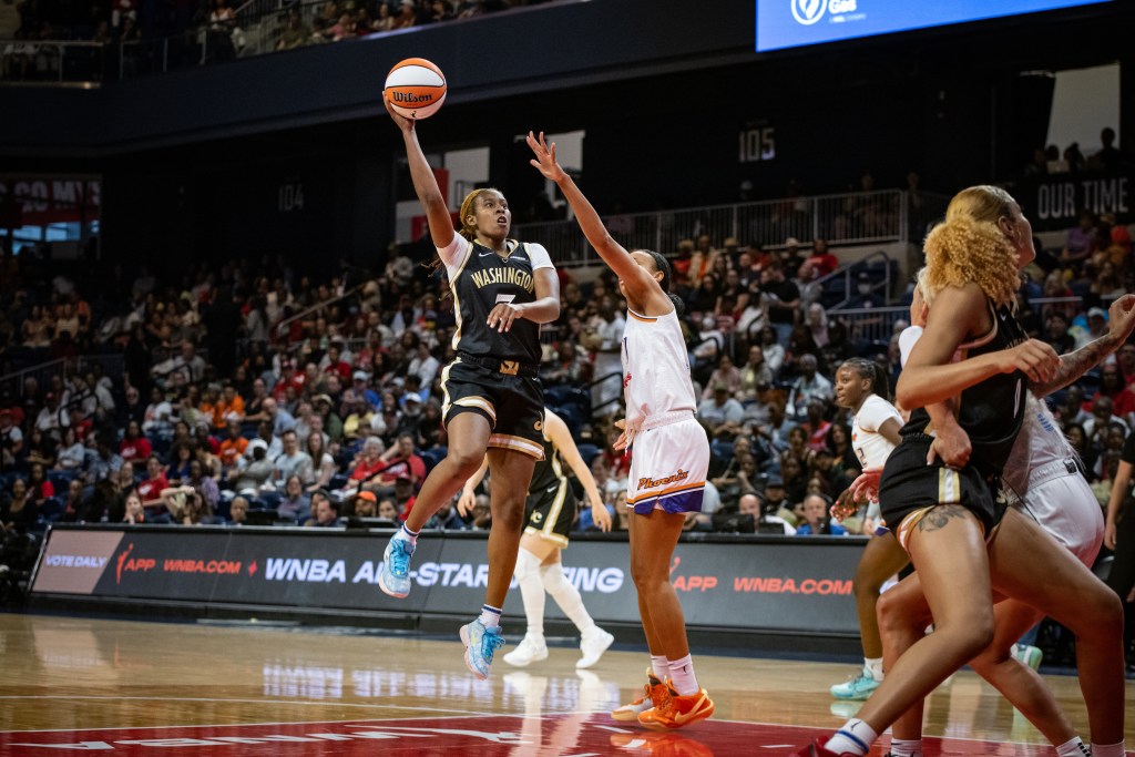 Washington Mystics guard Ariel Atkins shoots a right-handed floater near the free-throw line.