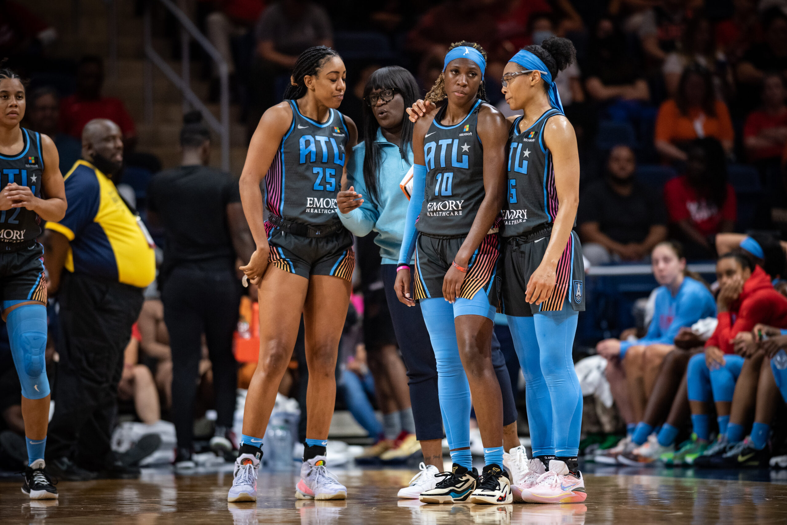 Assistant coach Barbara Turner, pictured alongside Rhyne Howard, Monique Billings and Allisha Gray
