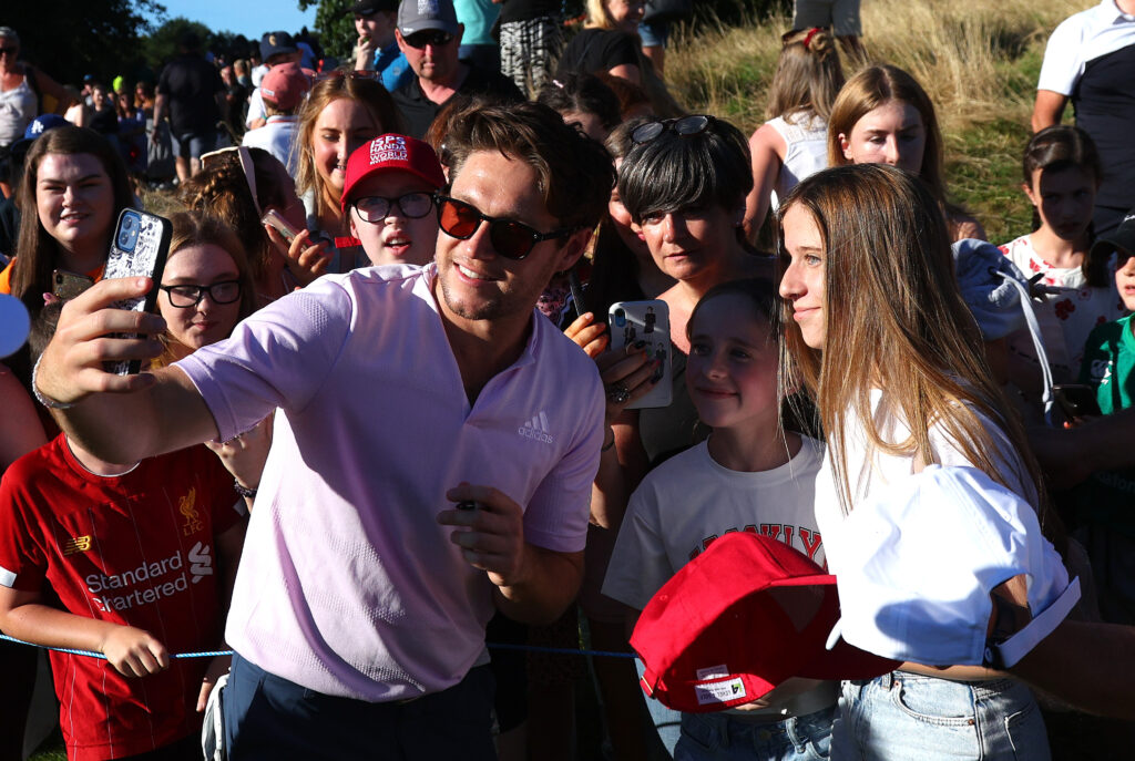 GALGORM - AUGUST 10: Niall Horan, Founder of Modest! Golf, takes a selfie with fans during the Pro Am event prior to the ISPS Handa World Invitational presented by AVIV Clinics at Galgorm Castle and Massereene Golf Clubs on August 10, 2022 in Co Antrim, Northern Ireland. (Photo by Andrew Redington/Getty Images)