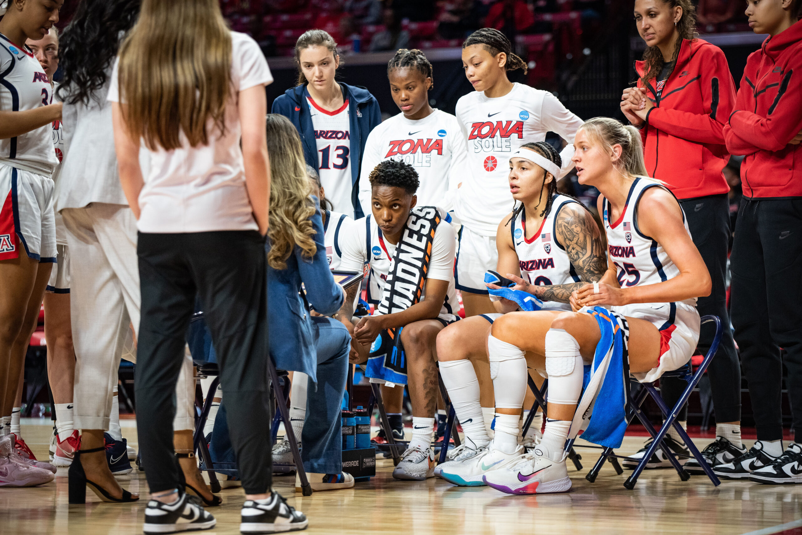 Arizona huddles up during a timeout of its First Round NCAA Tournament game against West Virginia