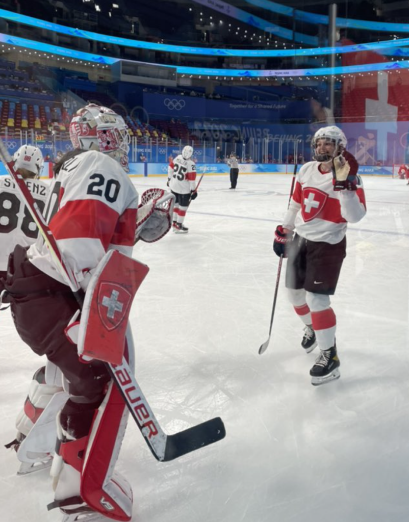 Alina Müller (R) celebrates a scored goal for her Swiss national team at the 2022 Beijing Olympic Winter Games. (Photo Credit / IIHF Twitter Page)
