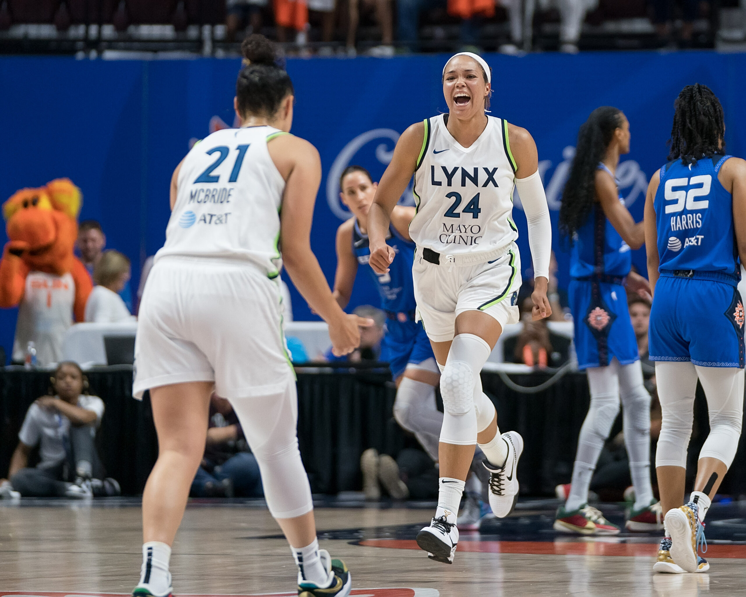 Minnesota Lynx forward Napheesa Collier reacts to a made basket in game two of Minnesota's playoff series against the Connecticut Sun. Guard Kayla McBride celebrates in the foreground.