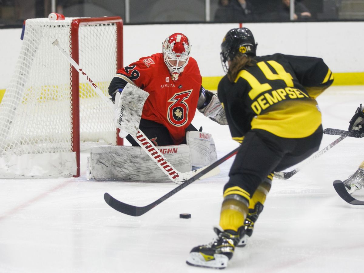 Jillian Dempsey heads towards Elaine Chuli in net