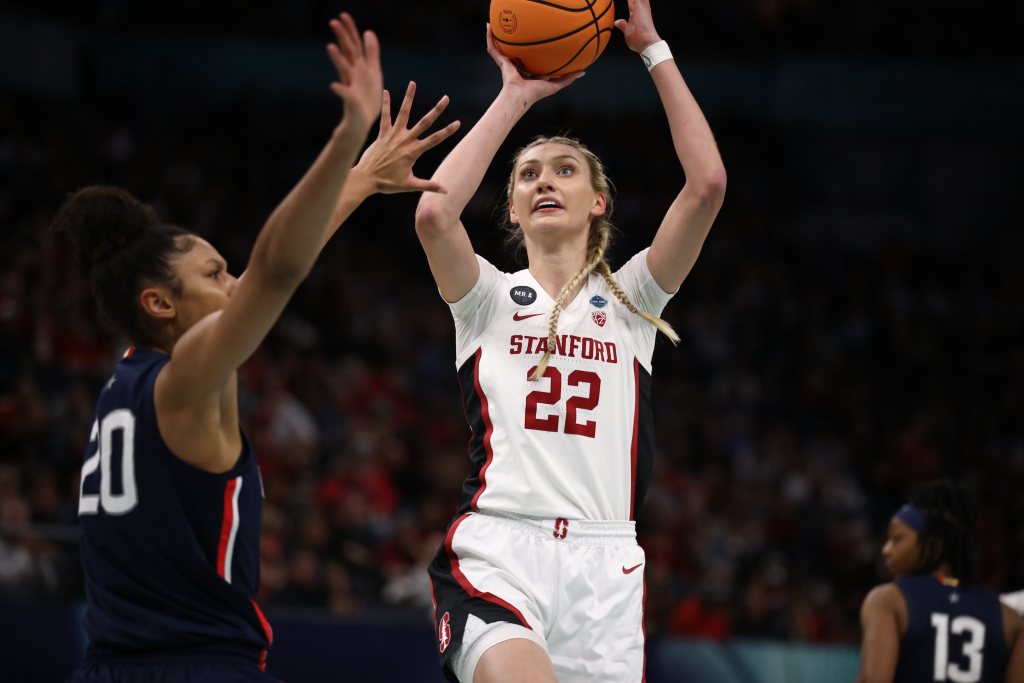 Stanford's Cameron Brink shoots the ball with her right hand as a UConn defender contests.