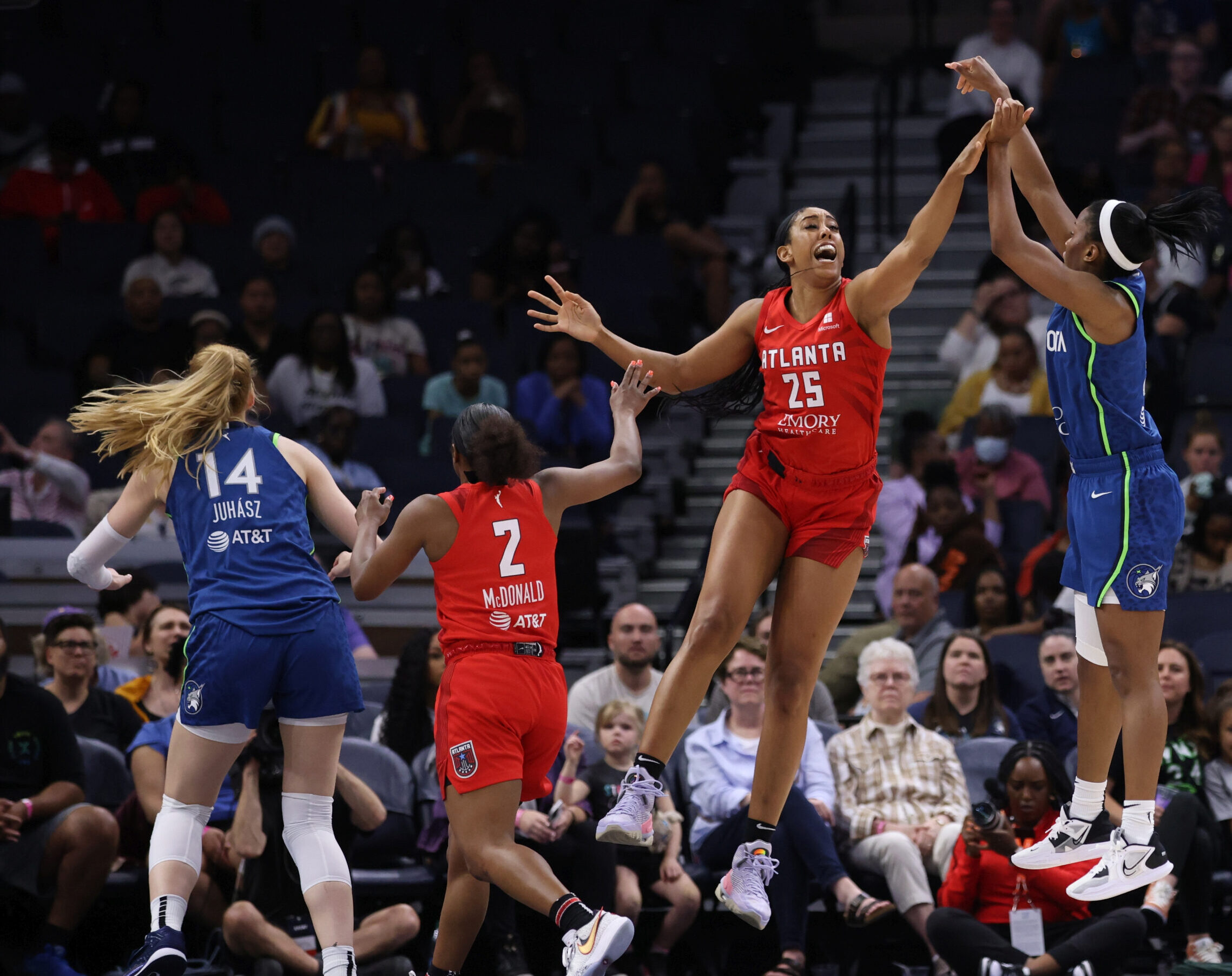 Atlanta Dream forward Monique Billings closes out on jump-shot in Minnesota.