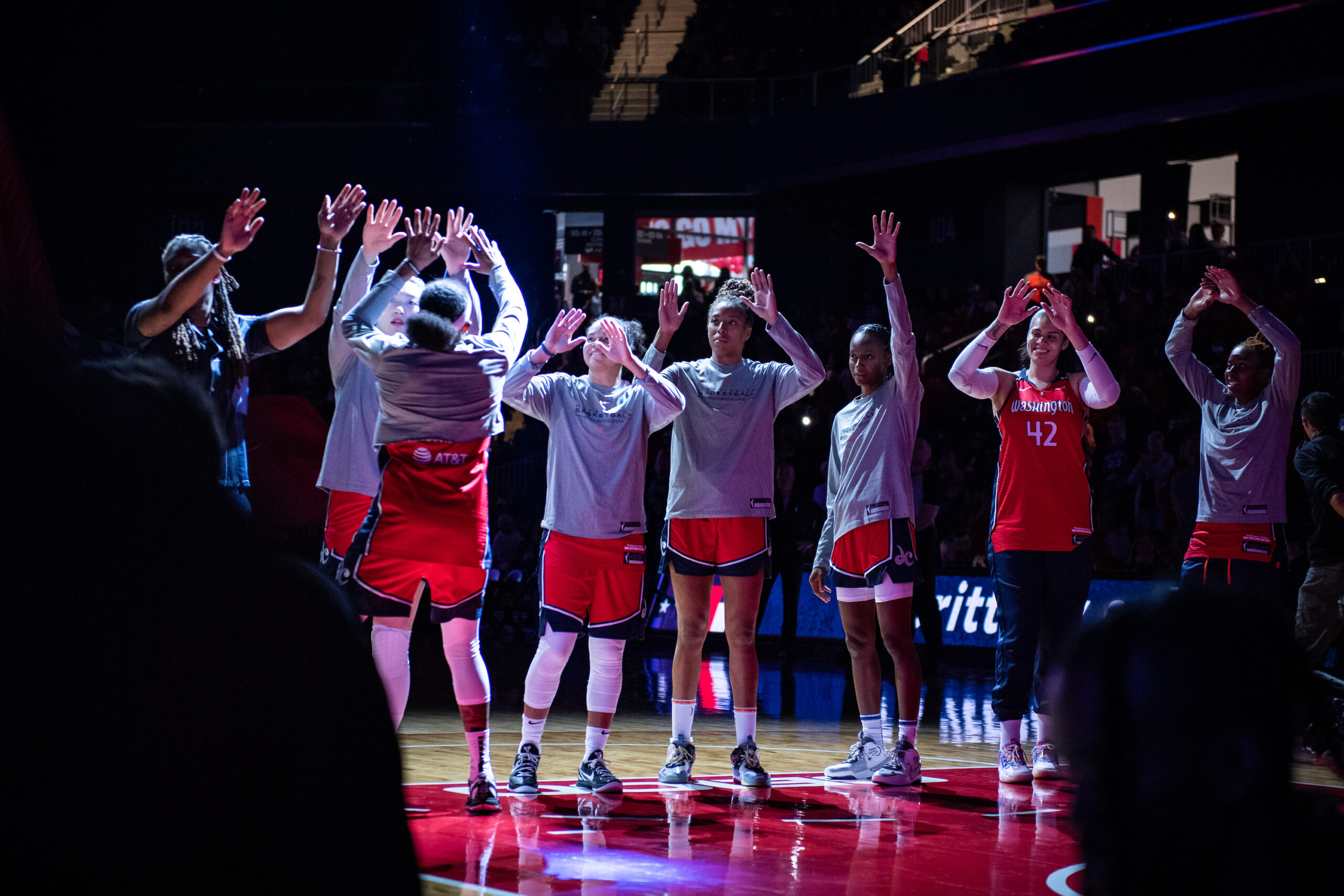 Washington Mystics guard Brittney Sykes side shuffles to high five a line of teammates before a game.Washington Mystics guard Brittney Sykes side shuffles to high five a line of teammates before a game.
