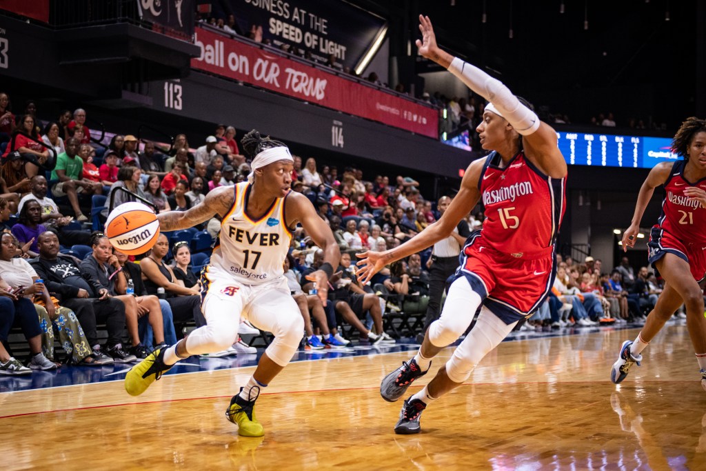 Washington Mystics guard Brittney Sykes defends Indiana Fever guard Erica Wheeler as Wheeler looks for an angle near the baseline.Washington Mystics guard Brittney Sykes defends Indiana Fever guard Erica Wheeler as Wheeler makes a move inside the arc.