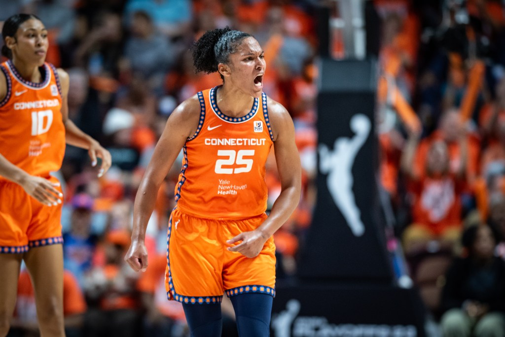 Alyssa Thomas screams and looks off to her left. 