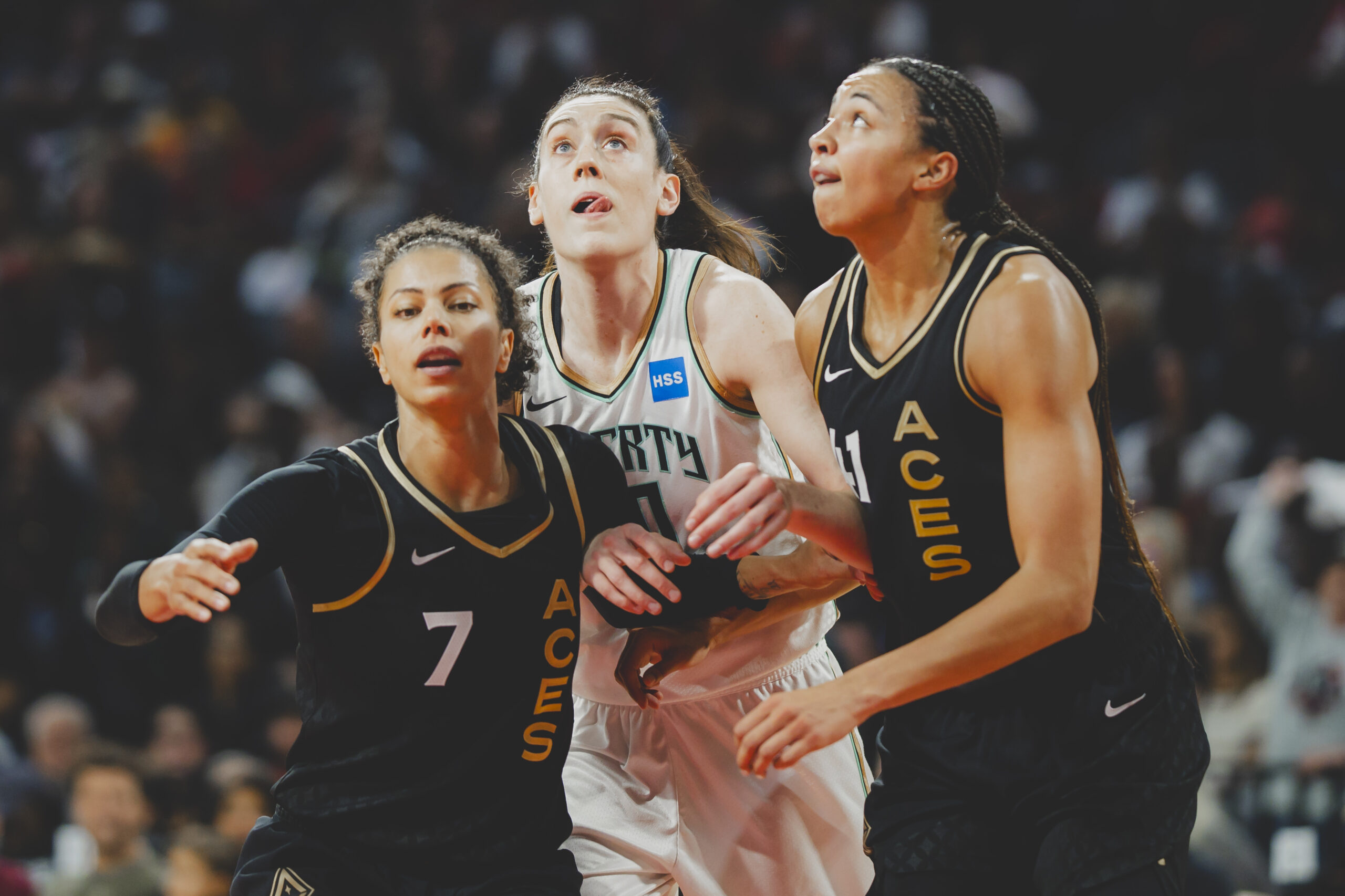 Alysha Clark (7) and Kiah Stokes (41) try to box out Breanna Stewart (30) during Game 2 of the WNBA Finals on October 11, 2023, at Michelob Ultra Arena.