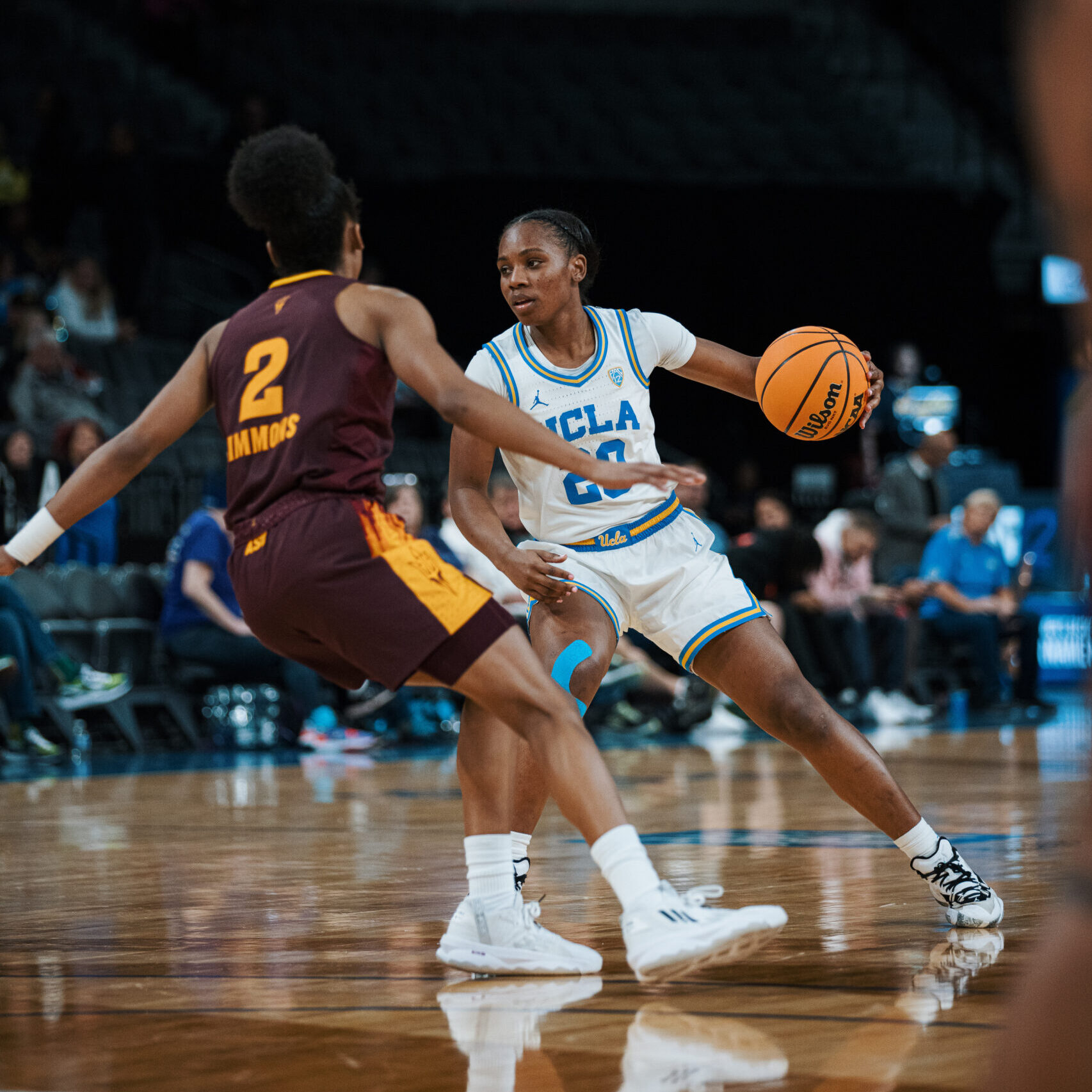 UCLA's Charisma Osborne drives into the lane during a Pac-12 matchup against USC.