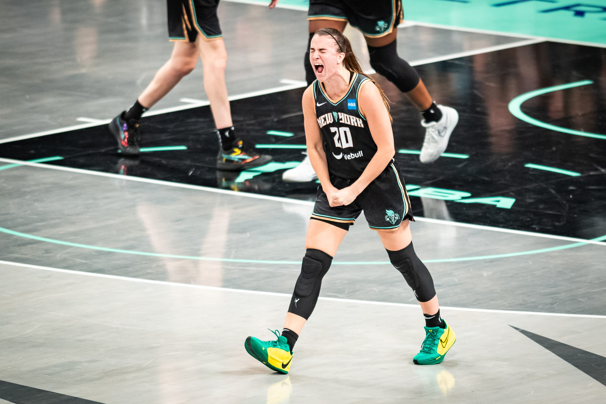 New York Liberty guard Sabrina Ionescu clenches her fists, closes her eyes and screams in celebration.