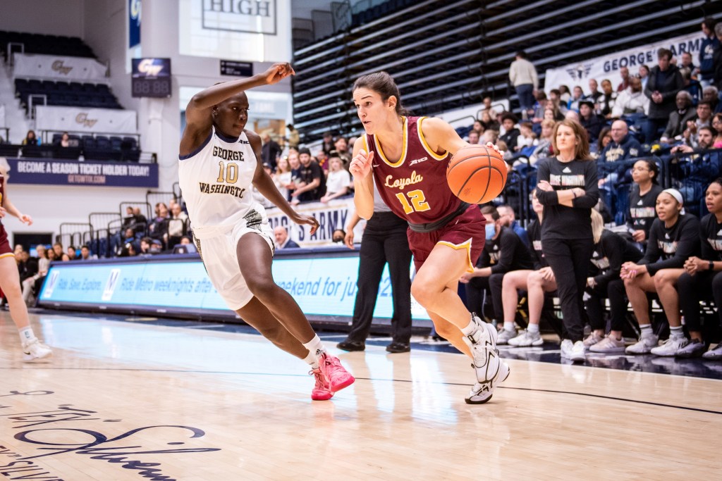 Loyola Chicago's Sam Galanopoulos drives against George Washington's Nya Lok