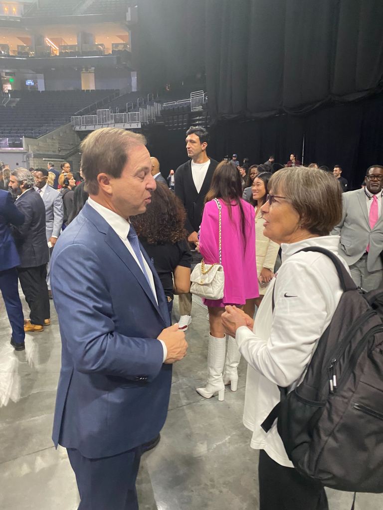 Warriors owner Joe Lacob and Stanford women's basketball coach Tara VanDerveer chat at the Chase Center announcement of the WNBA team in San Francisco, CA on Oct. 5, 2023. (Michelle Smith photo)