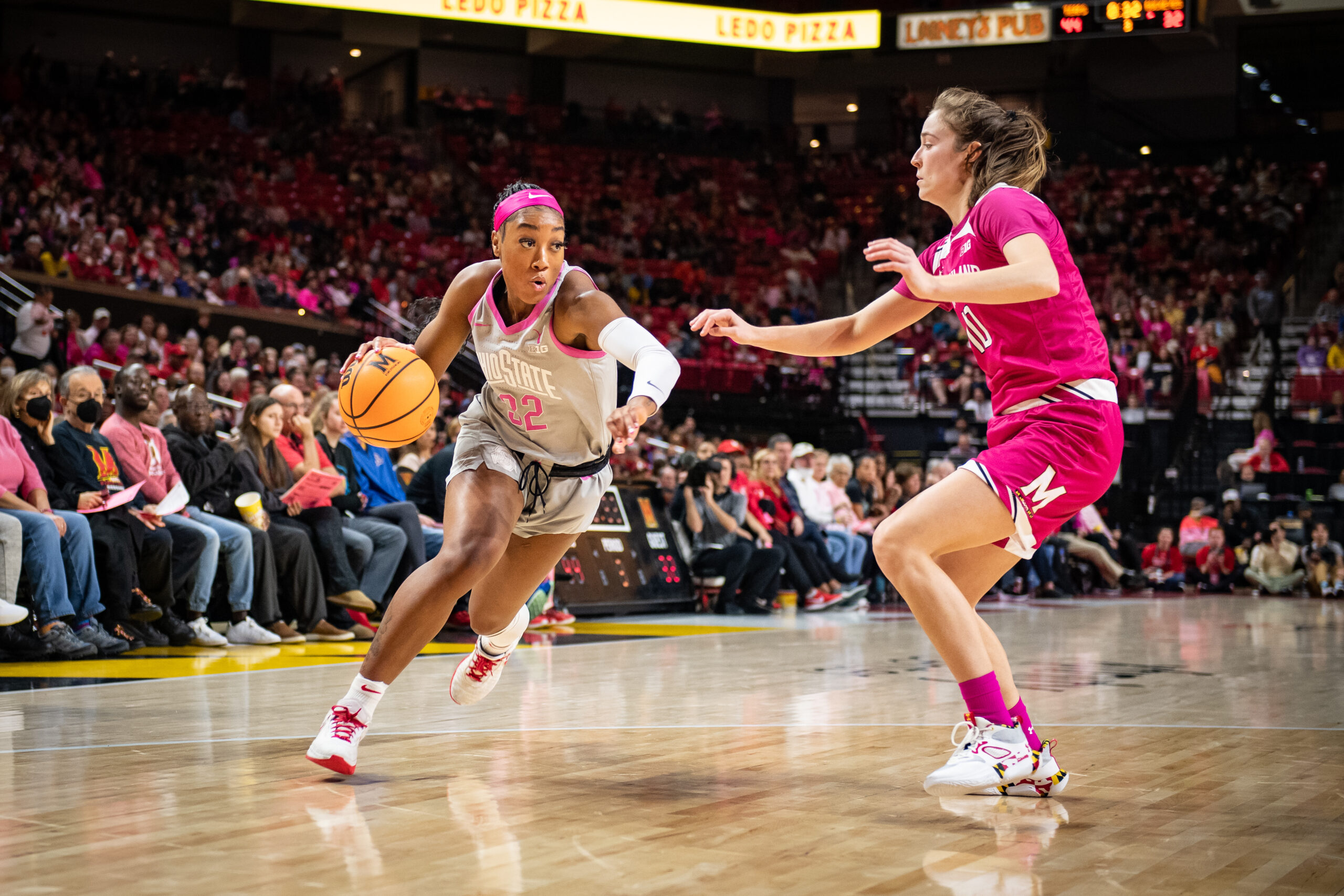 Ohio State's Cotie McMahon (32) drives towards her defender during a game at Maryland.