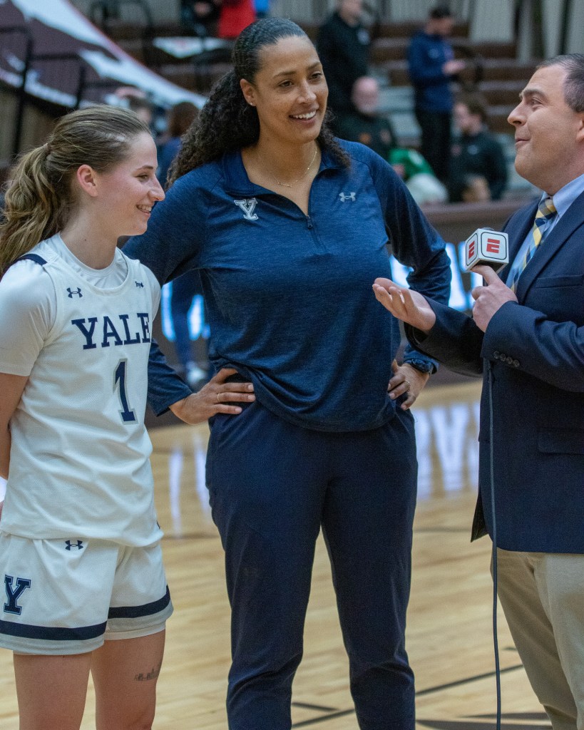 Yale head coach Dalila Eshe and guard Jenna Clark smile during an on-court interview with ESPN.