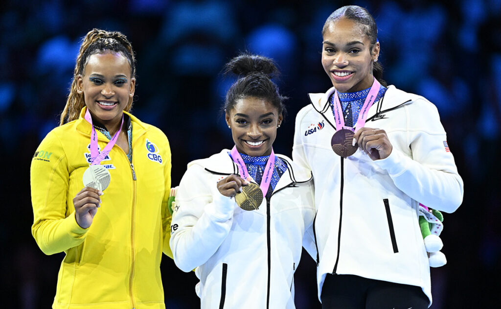 From left, Rebeca Andrade of Brazil, Simone Biles, and Shilese Jones on the women's all-around podium at world championships. Photo credit: USA Gymnastics