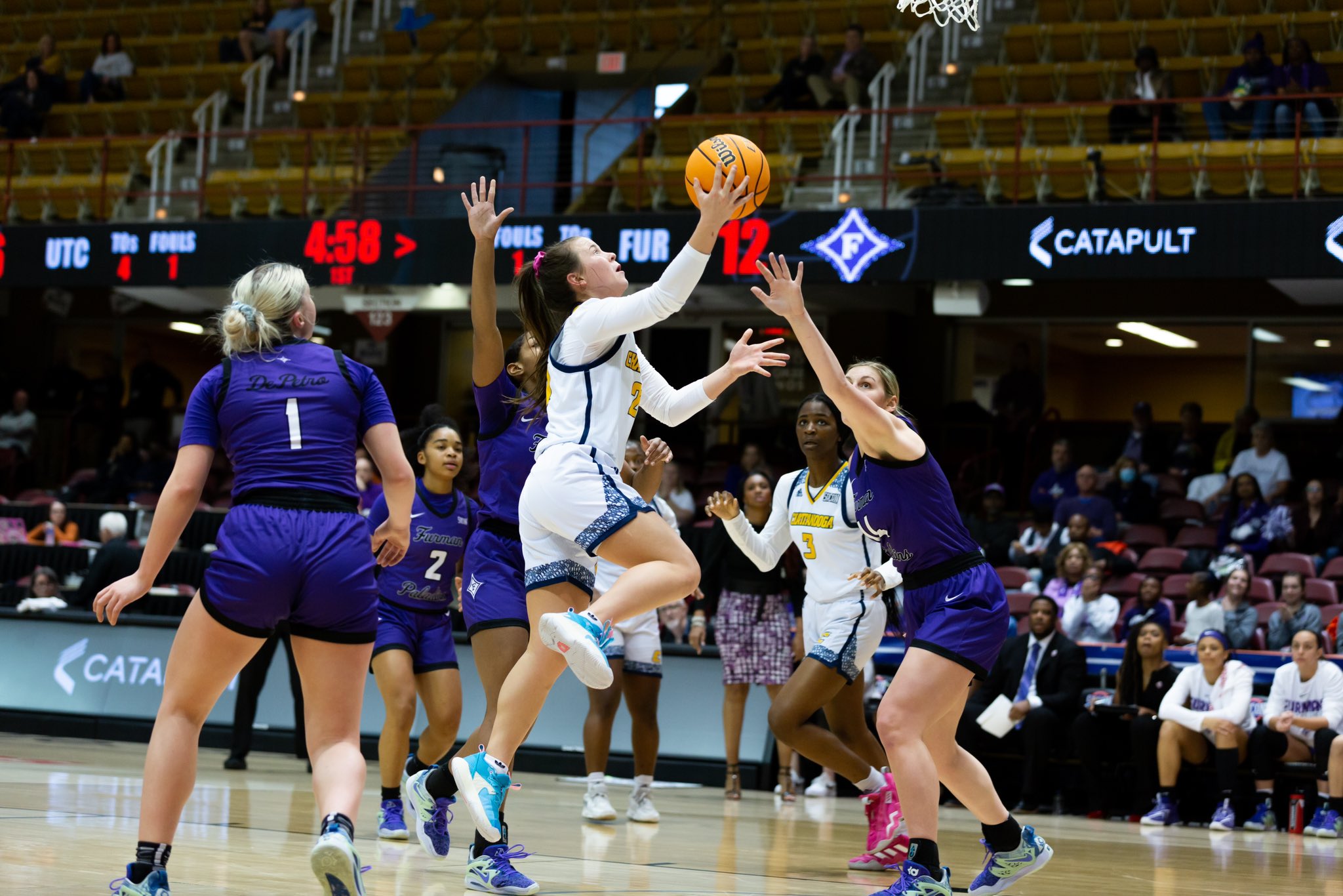 Chattanooga's Addie Porter rises for a right-handed layup as a Furman help defender is too late to contest.
