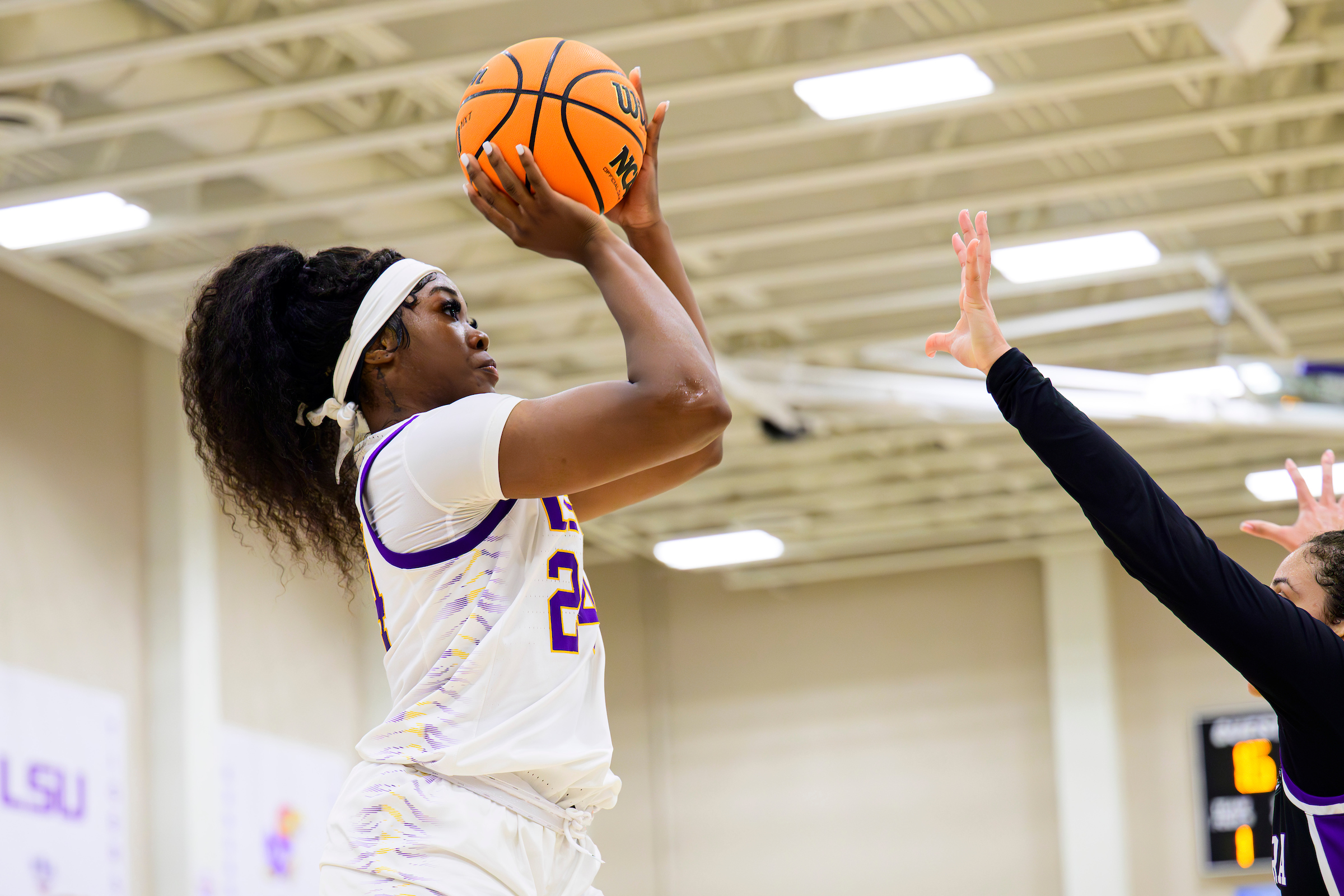 LSU big Aneesah Morrow holds the ball out in front of her forehead as she starts to release a jump shot during FloHoops Feast Week.