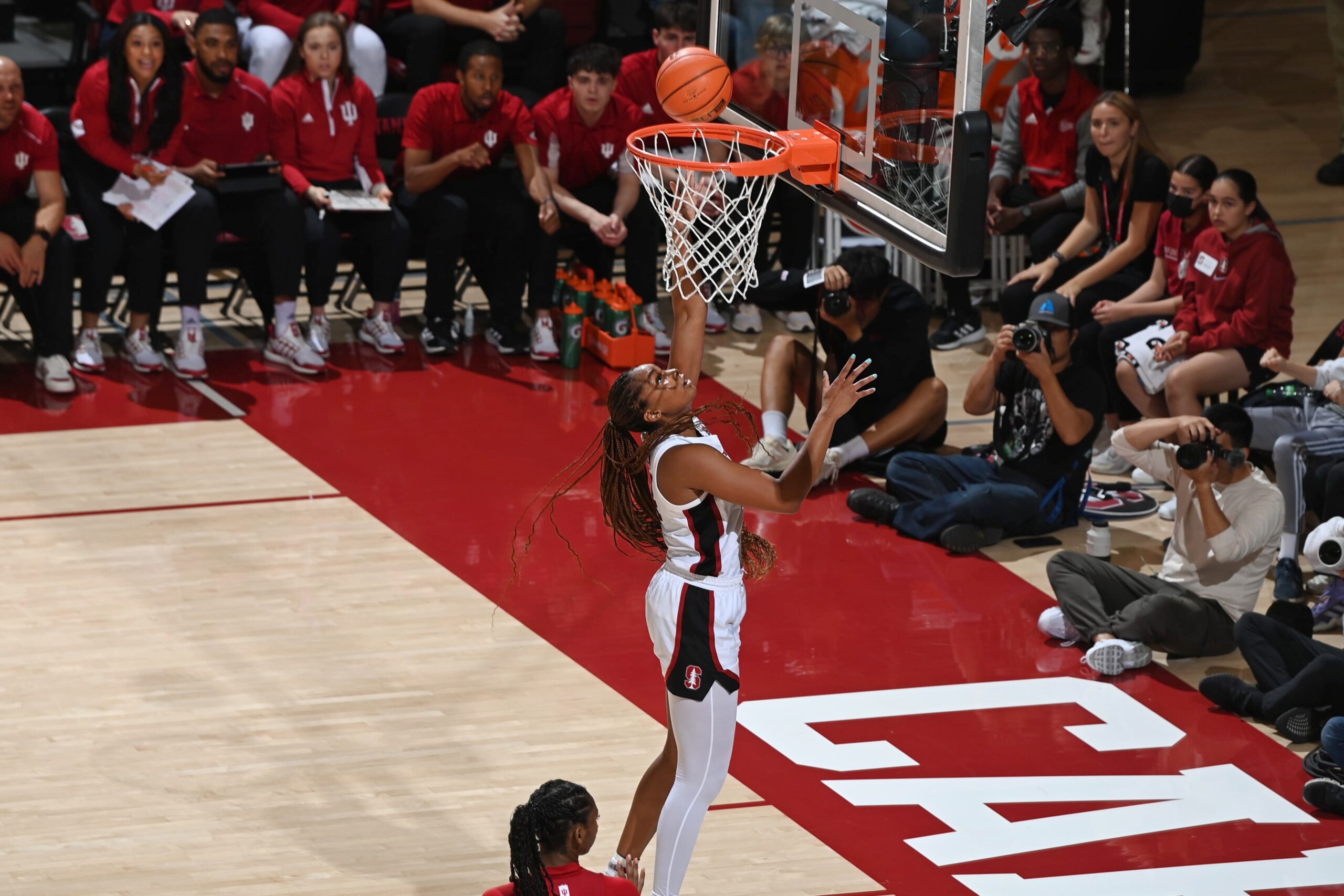 Stanford forward Kiki Iriafen goes for a layup during a game against Indiana at Maples Pavilion. No other players can be seen around the paint.