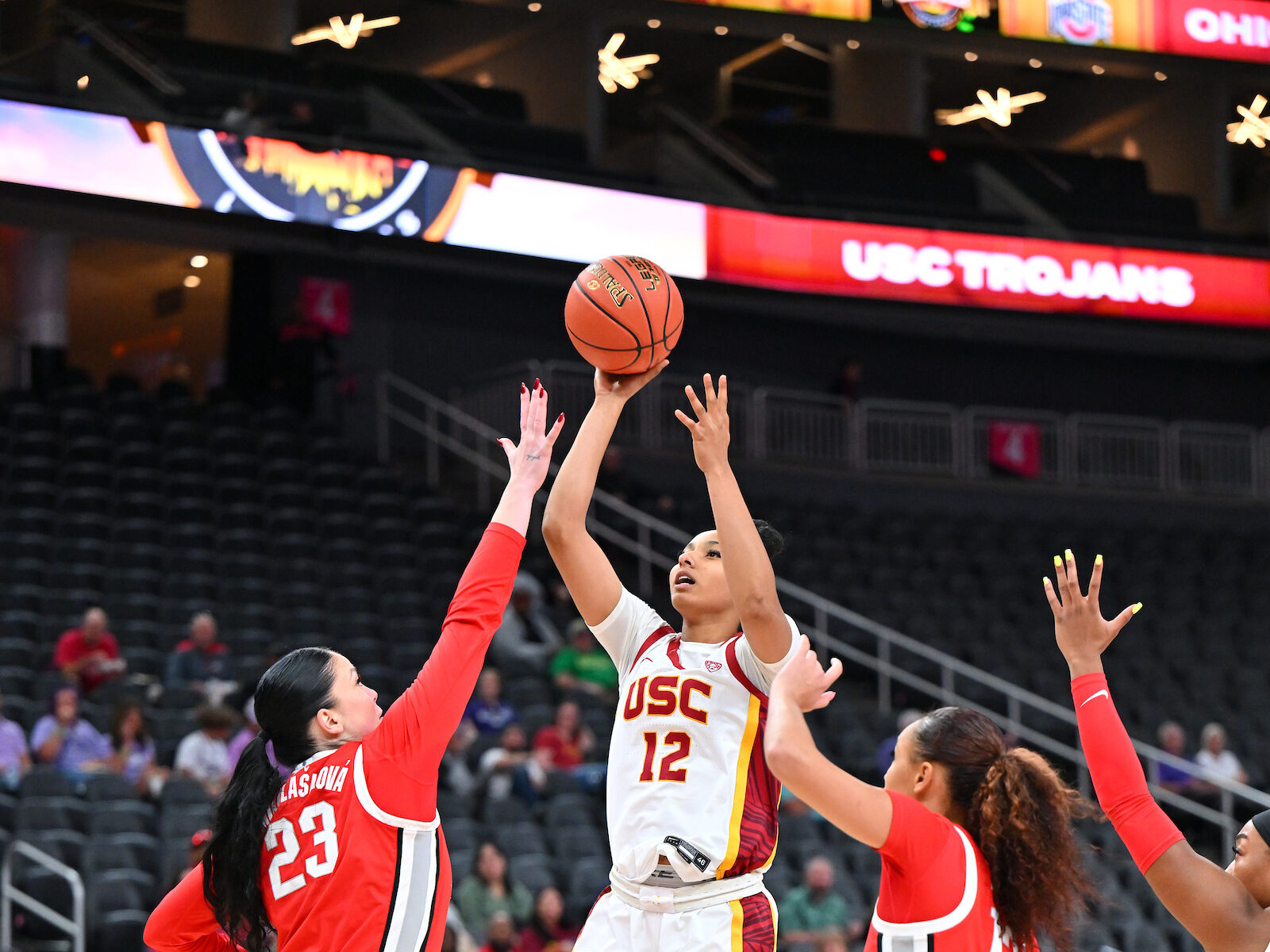 USC's JuJu Watkins shoots over two Ohio State defenders in the Hall of Fame Series at T-Mobile Arena in Las Vegas, Nev., on Nov. 6, 2023. (Photo credit: John McGillen/USC Athletics)
