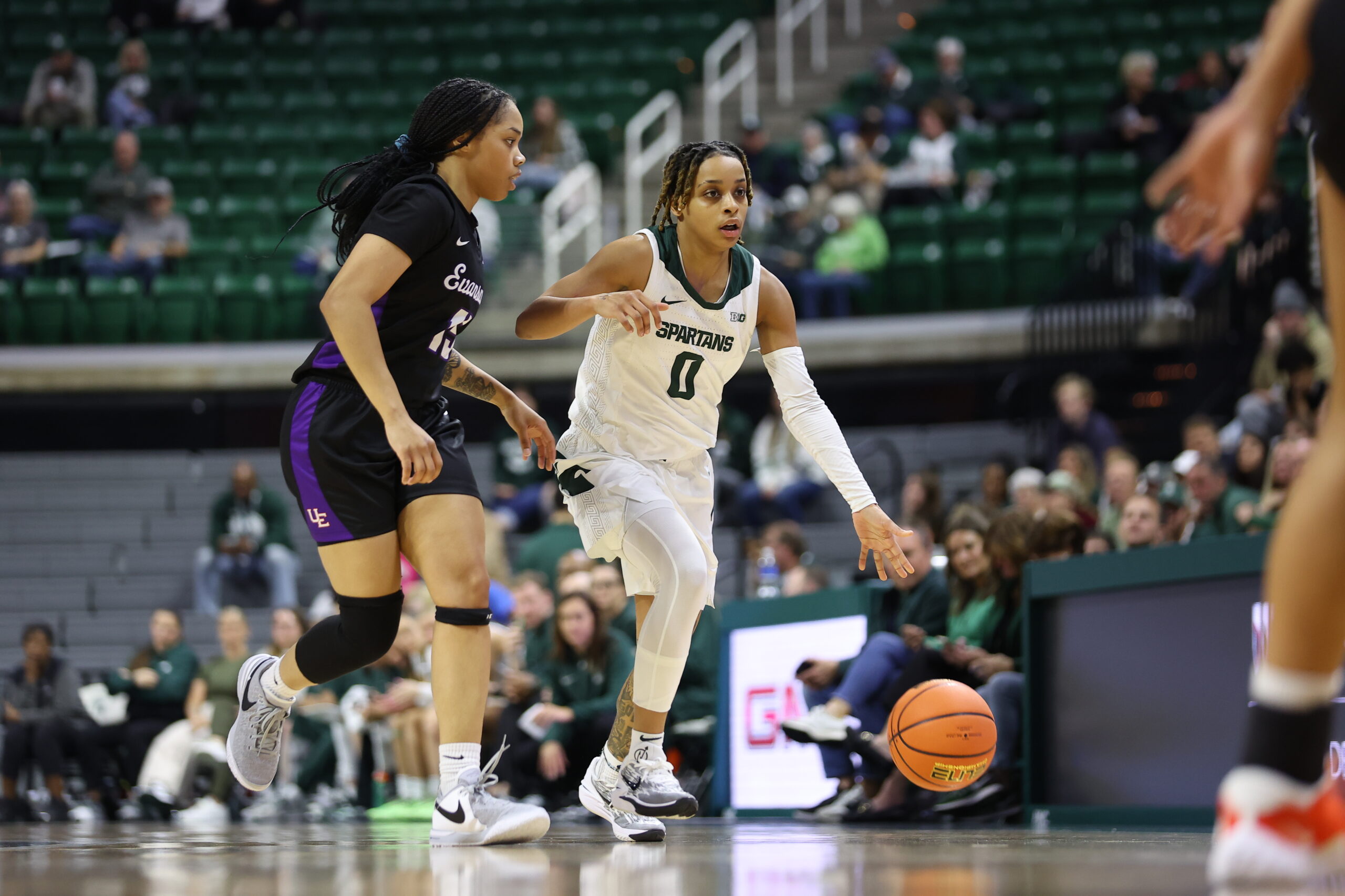 DeeDee Hagemann dribbles the ball up the floor for Michigan State against Evansville.