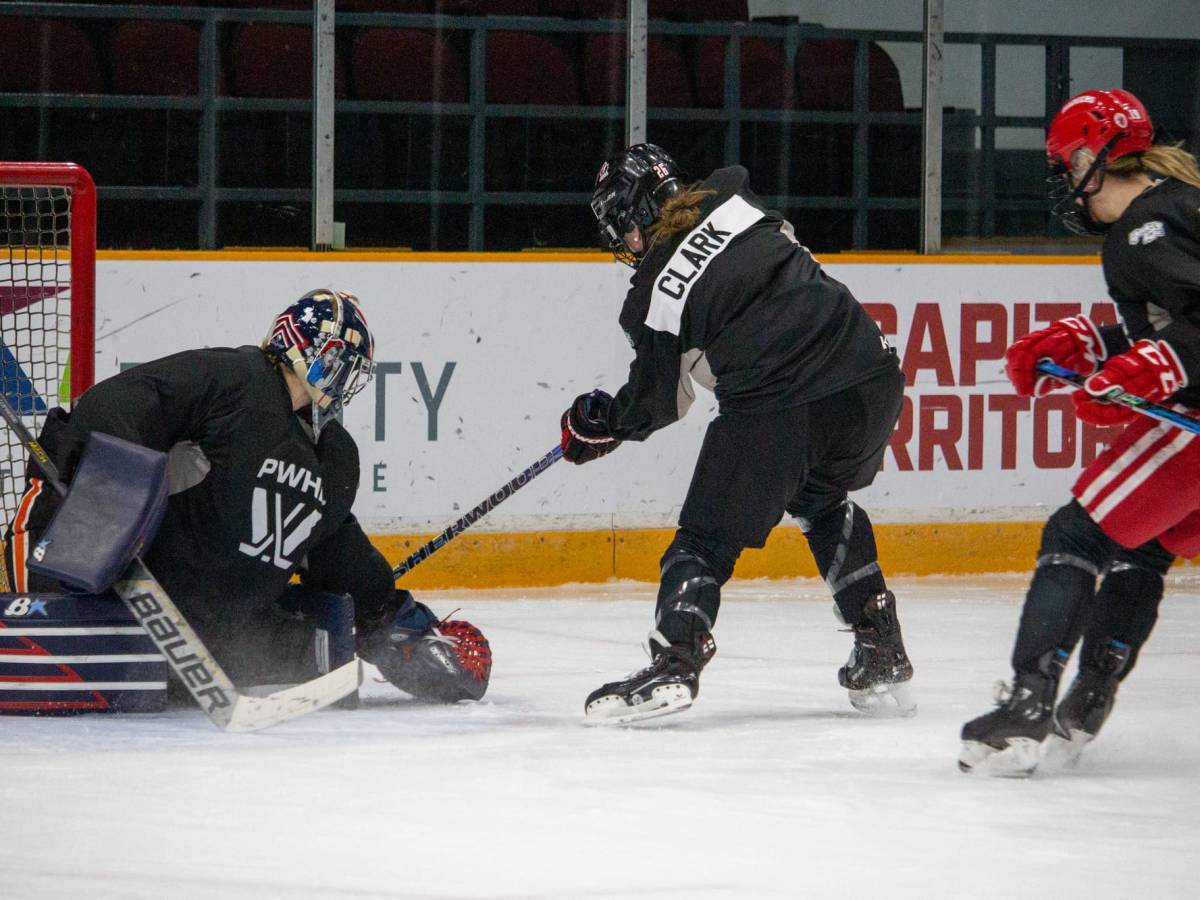 Skater Emily Clark makes a move on goaltender Rachel McQuigge