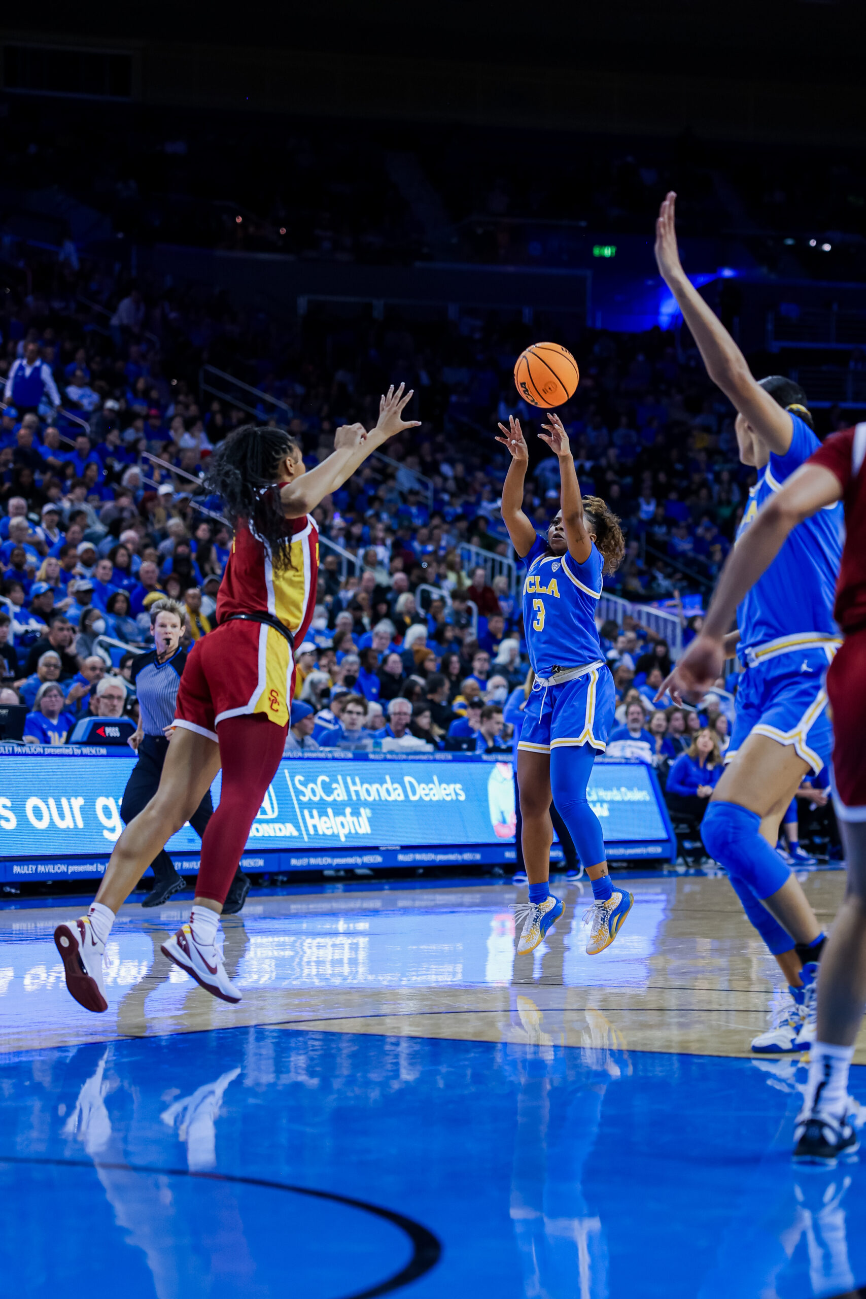 UCLA's Londynn Jones shoots from long distance against USC. (Photo via Lillie Yazdi/UCLA Athletics)