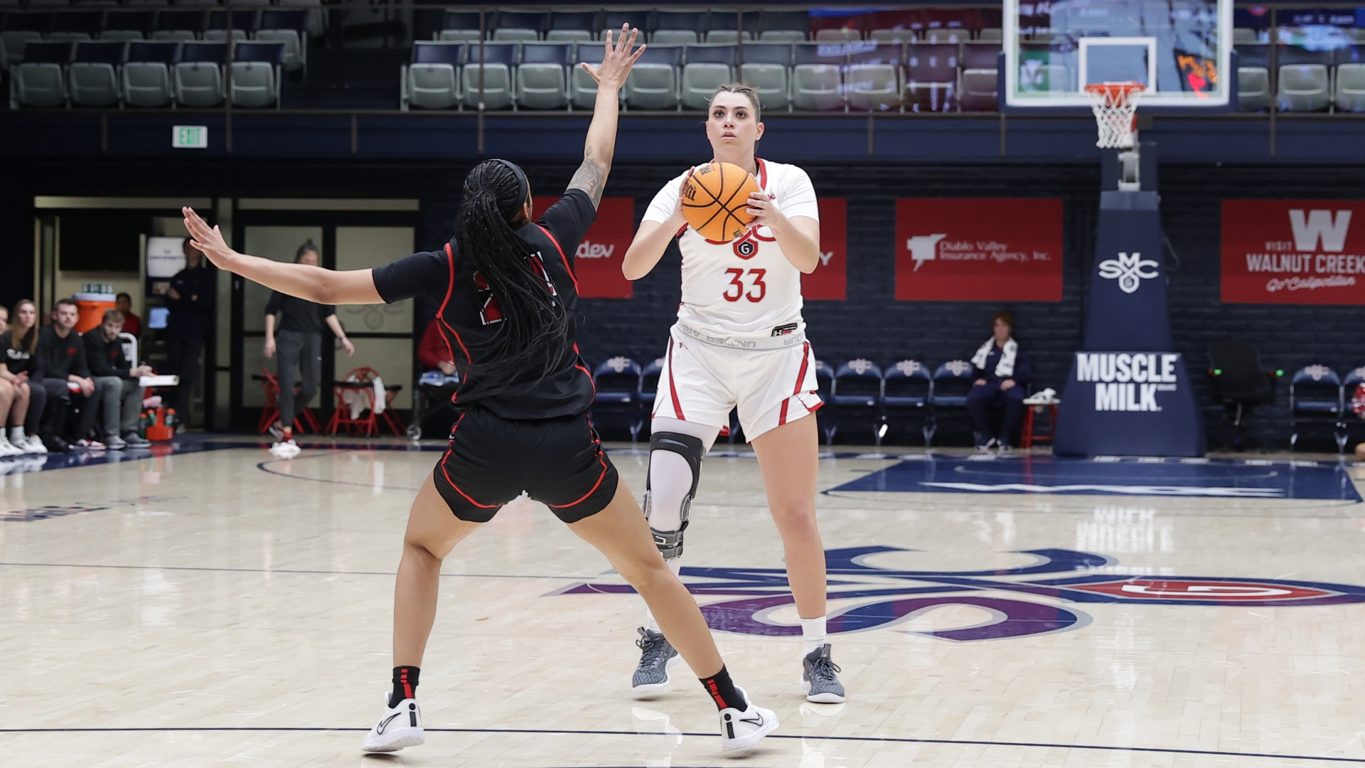 Saint Mary's forward Ali Bamberger prepares to shoot a 3-pointer from the top of the key as an Illinois State defender contests.