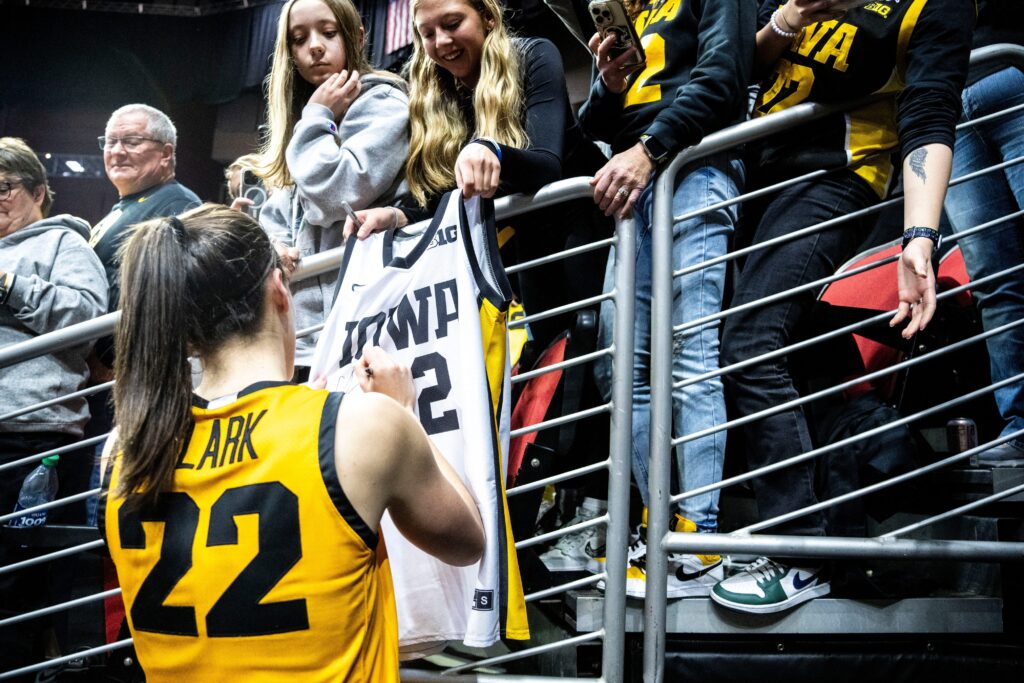 Iowa guard Caitlin Clark signs autographs for fans during the Hawkeye Showcase at Wells Fargo Arena on Saturday, Dec. 16, 2023, in Des Moines. (IMAGN via Des Moines Register)