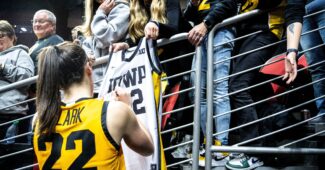 Iowa guard Caitlin Clark signs autographs for fans during the Hawkeye Showcase at Wells Fargo Arena on Saturday, Dec. 16, 2023, in Des Moines. (IMAGN via Des Moines Register)