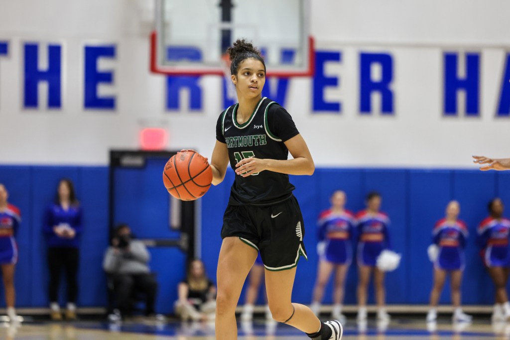 Facing little defensive pressure, Dartmouth guard Victoria Page dribbles the ball with her right hand.
