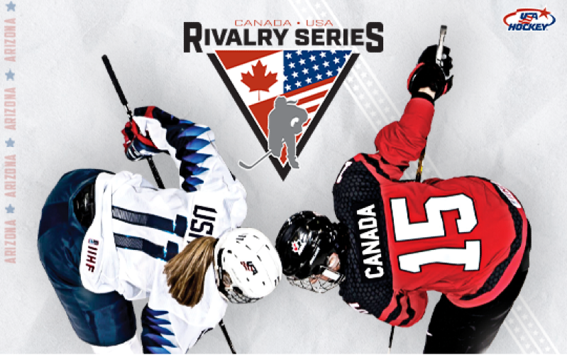 Two hockey players (one in a white, USA #11 jersey an another in a red, Canada #15 jersey face off for a puck drop. They are pictured against a backdrop that includes the Rivalry Series logo, containing flags for both countries.