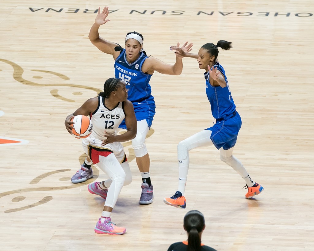Brionna Jones and DeWanna Bonner double-team Aces’ <a rel=