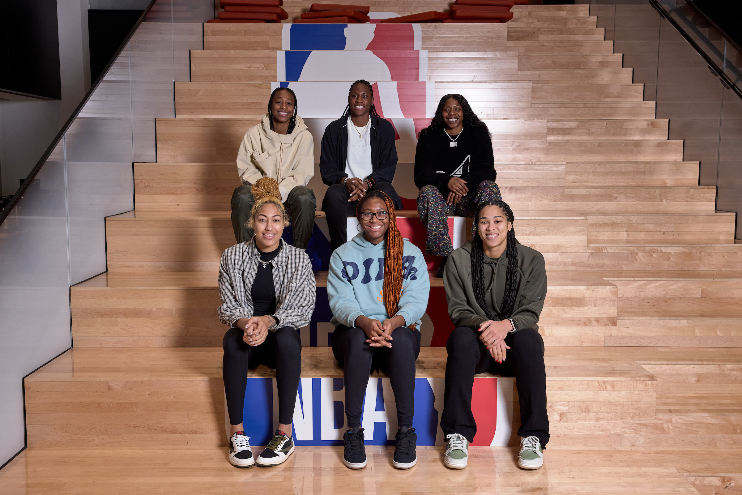 Jewell Loyd, Rhyne Howard, Arike Ogunbowale, Shakira Austin, Aliyah Boston and Brionna Jones sit at the WNBA league office.