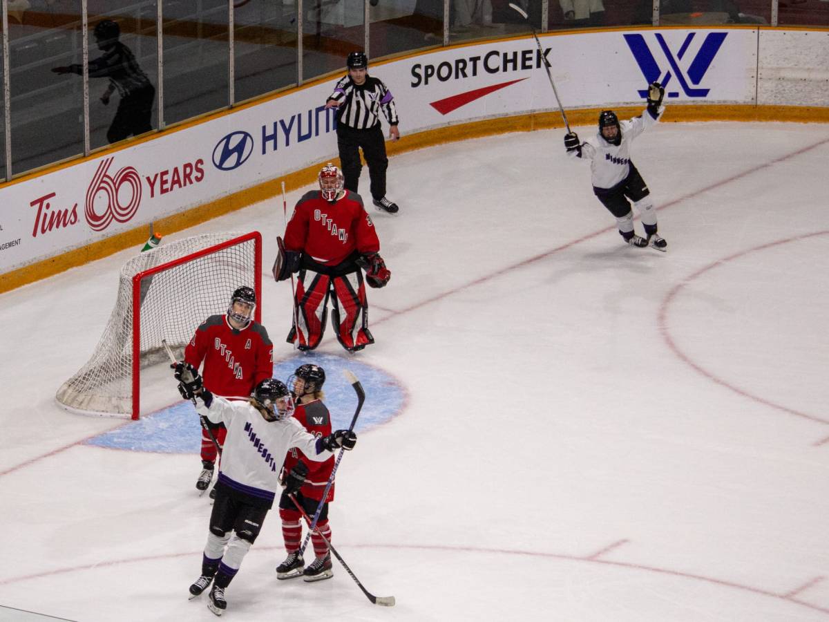 Two PWHL Minnesota players cheer while three PWHL Ottawa players hang their heads.